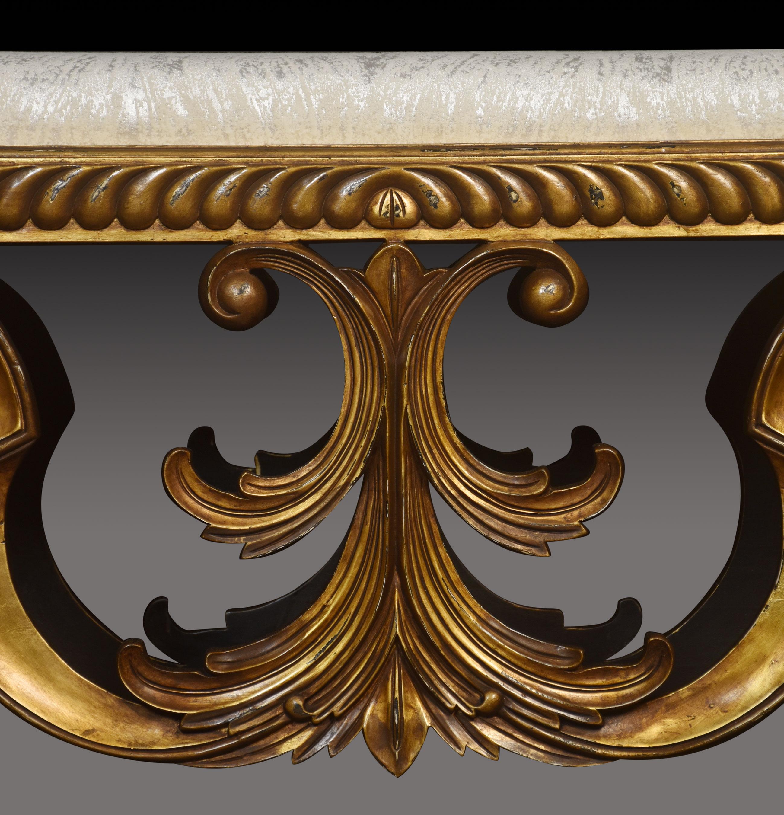 Carved giltwood dressing table stool, the upholstered cushion of rectangular form, to the moulded freeze raised up on scrolling base.
Dimensions
Height 22.5 Inches
Width 47.5 Inches
Depth 16 Inches.