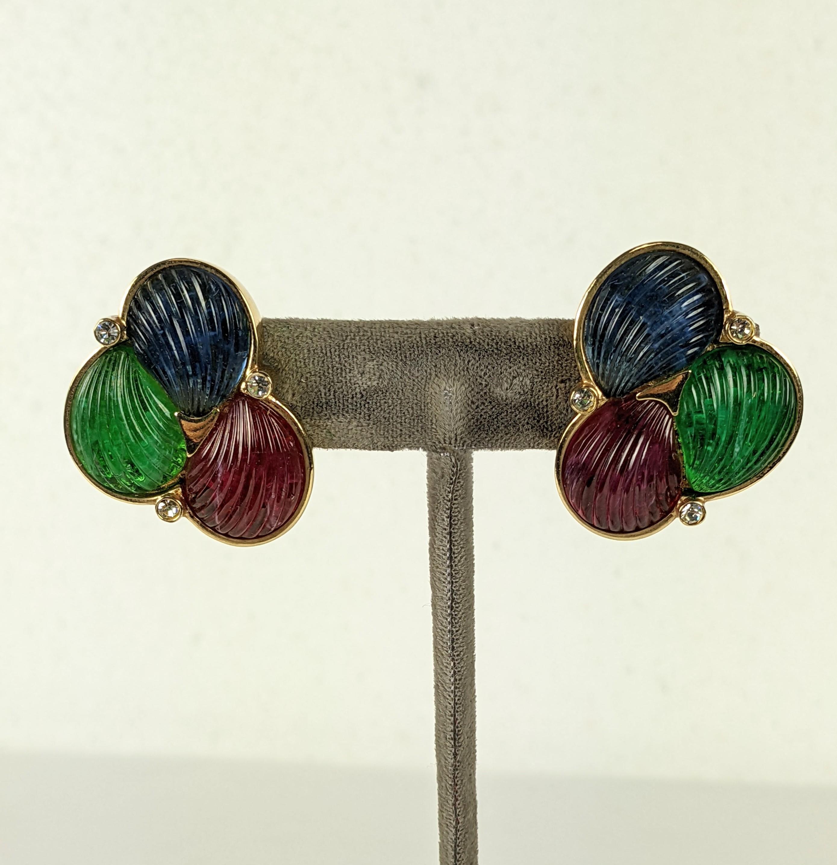 Glass carved fruit salad clip earrings circa 1980s of ruby, emerald and sapphire Gripoix-style glass carved and ribbed scallop shell cabocheons set in gilt plate metal with crystal rhinestone accents . Clip back fittings. Italian.
Excellent