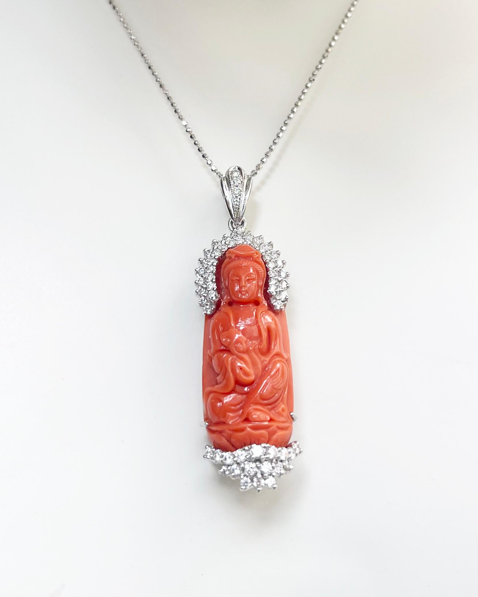 Carved Coral 38.20 carats with Diamond 0.79 carat Pendant set in 18K White Gold Settings
(chain not included)

Width: 1.6 cm 
Length: 5.5 cm
Total Weight: 13.69 grams


