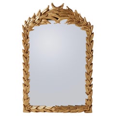 Specchio in legno dorato intagliato