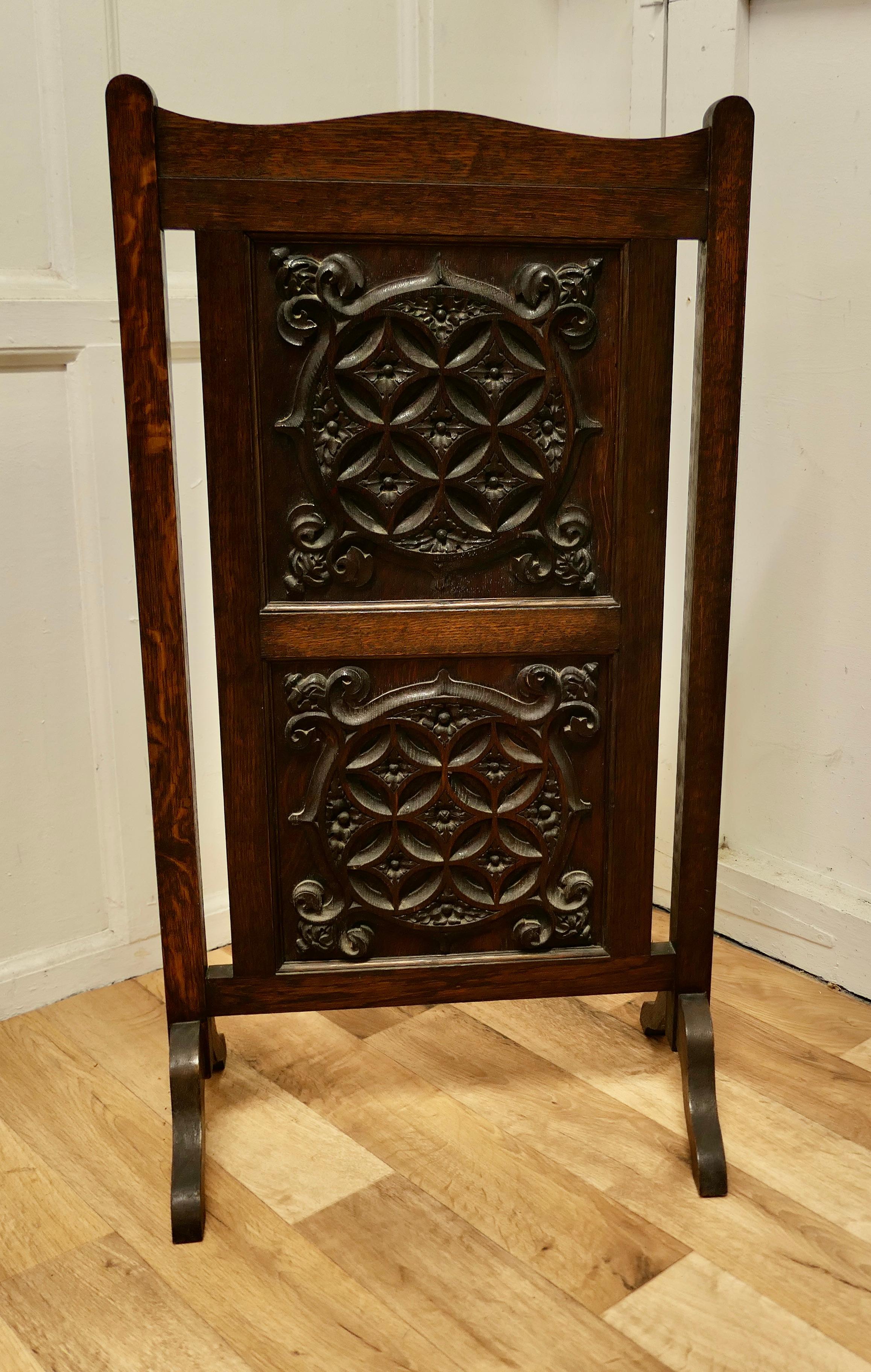 Carved Gothic oak panelled fire screen.

This sturdy screen has 2 heavy carved panels set in an oak frame.
The screen is in good condition with a nice patina.
The screen is 36” high and 20” wide.
THM217.