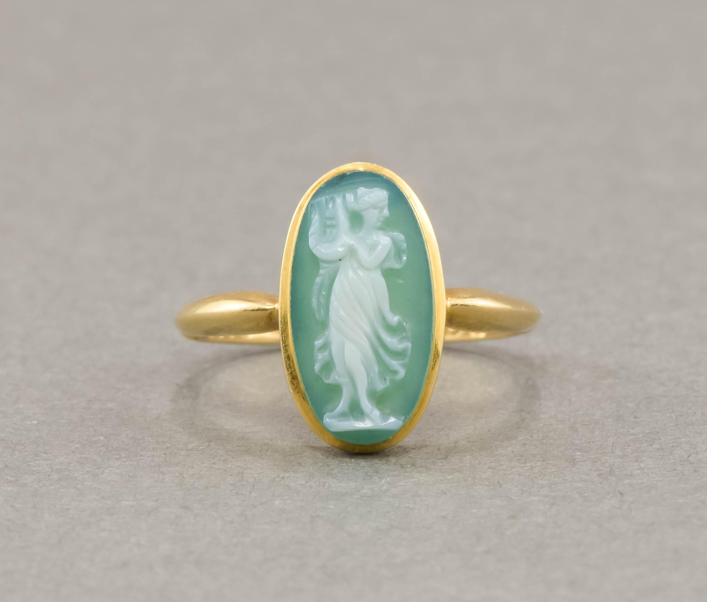 Being very partial to green gems, I was so pleased to find this antique hand carved green chalcedony cameo ring at a recent auction.  In fantastic condition, it retains its original English hallmarks dating it to 1909.

Crafted of solid 18K yellow