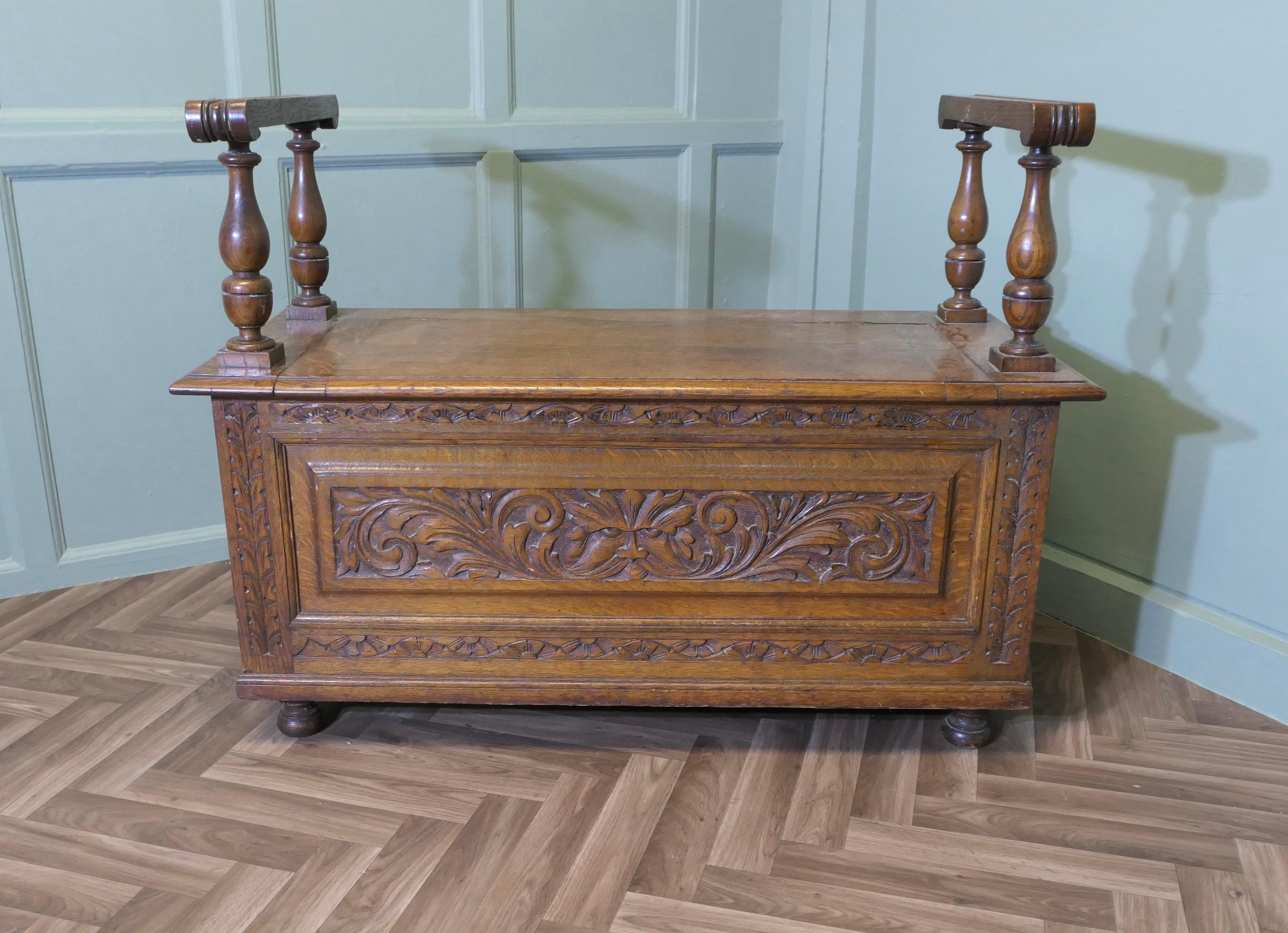 
Carved Golden Oak Coffer, Hall Seat

This is a lovely old piece and a very useful Hall Bench, it has storage under the seat, the coffer has a carved front showing the face of the green man and carve side panels with high arm rests
This is a very