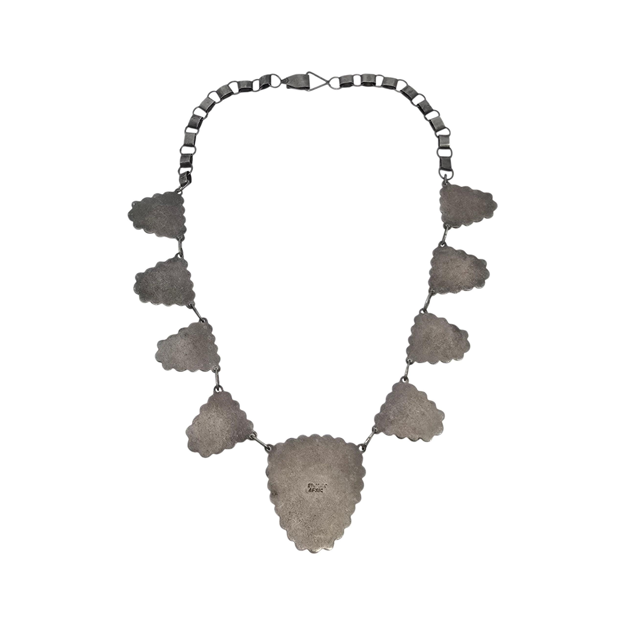 Carved Green Stone Face Sterling Silver Mexico Necklace

This beautiful necklace features a large carved green stone face bezel set with beaded and filigree frame at its center with 4 of the same smaller dangles on each side. Hook closure.

Weighs