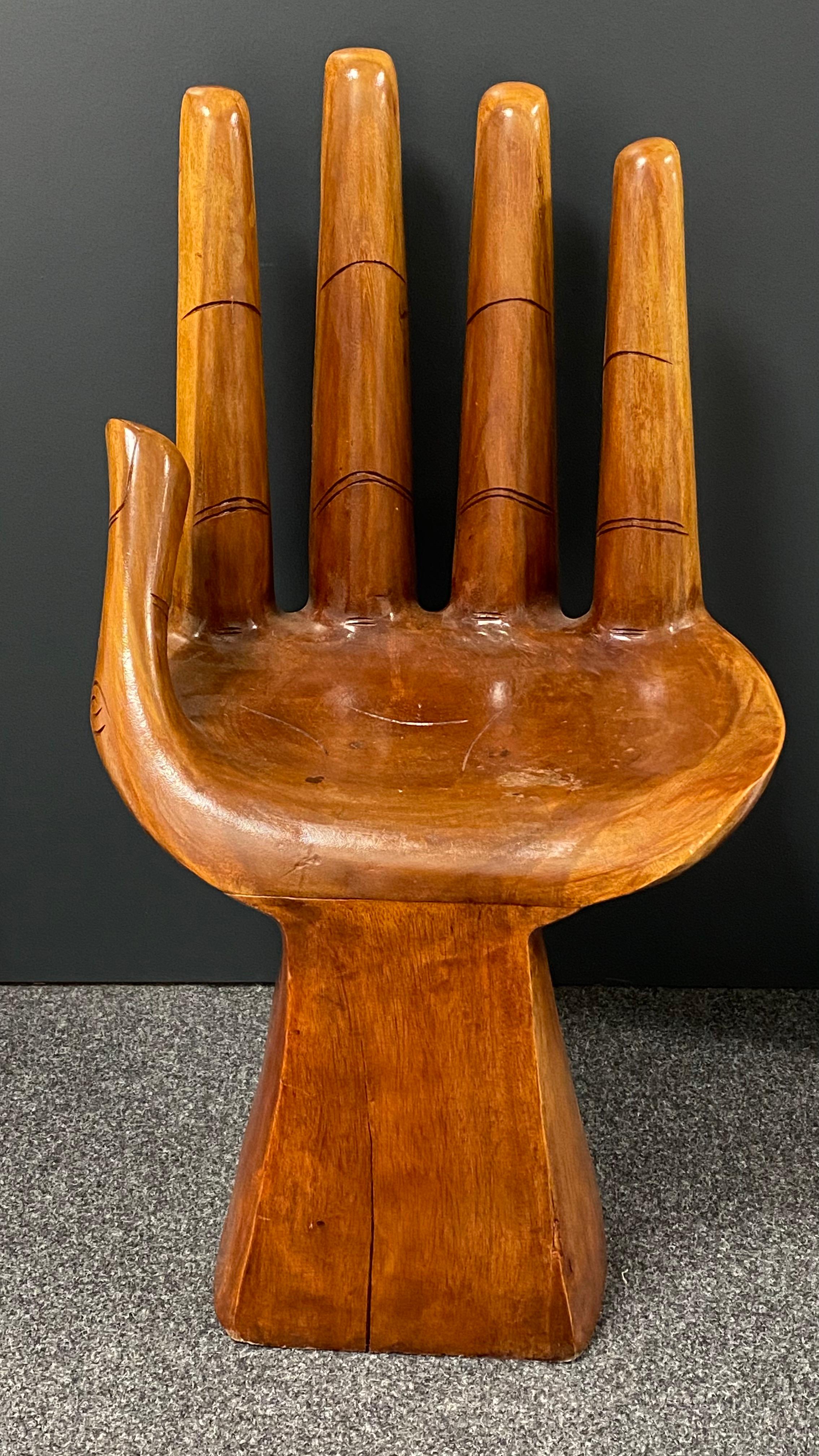 An amazing Mid-Century Modern finely detailed studio carved hand chair, circa 1970s. The artist has carved elegant fingernails.
A nice addition to any room.