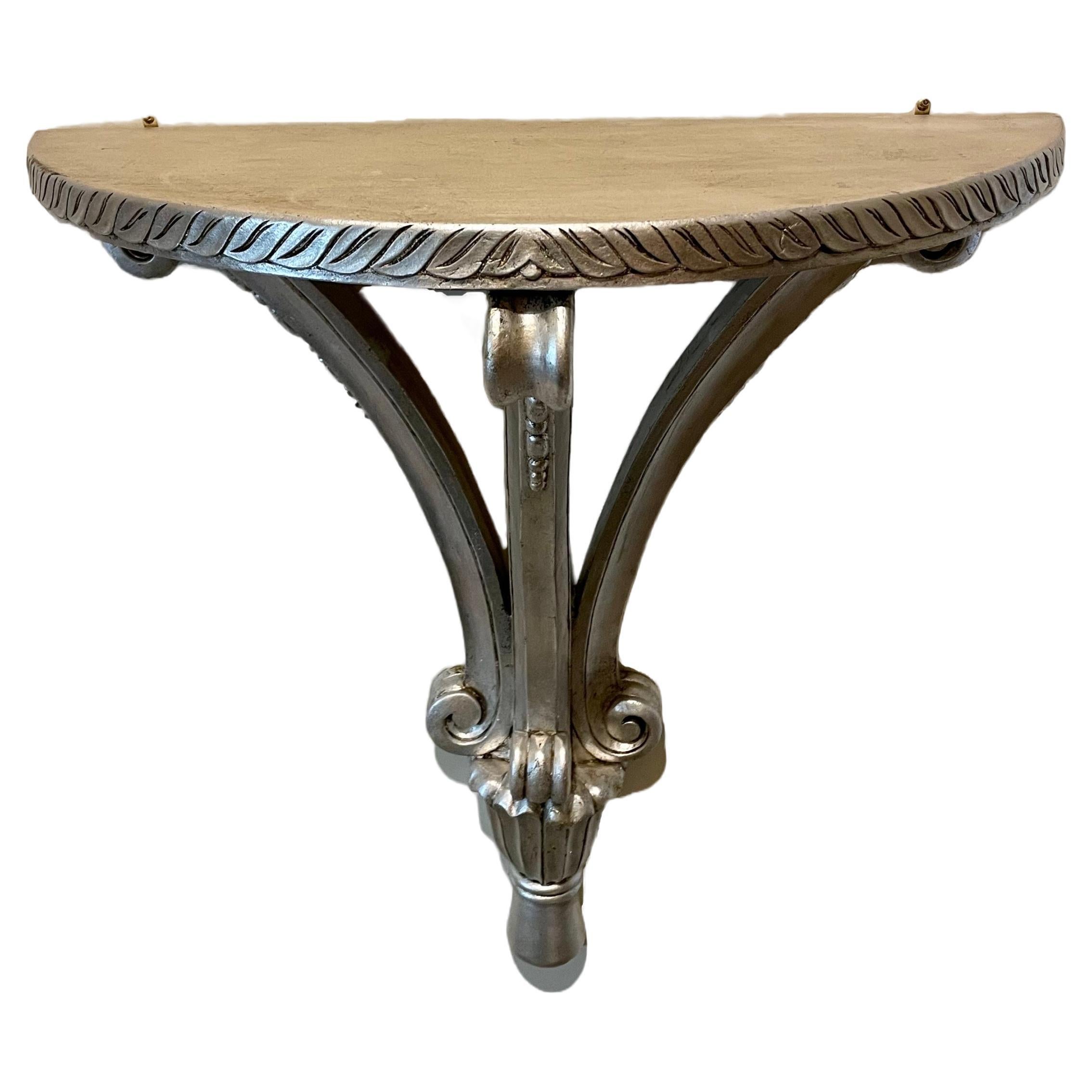 Italian Carved Hanging Silver Leaf Demi Lune  Hanging Console Table.  Nice details, some wear to finish from age and use. Great size measuring 23.5 wide and only 10