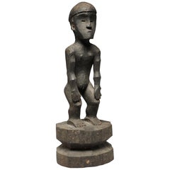 Carved Hardwood Philippine Standing Bulul Figure with Cap, Hands on Knees