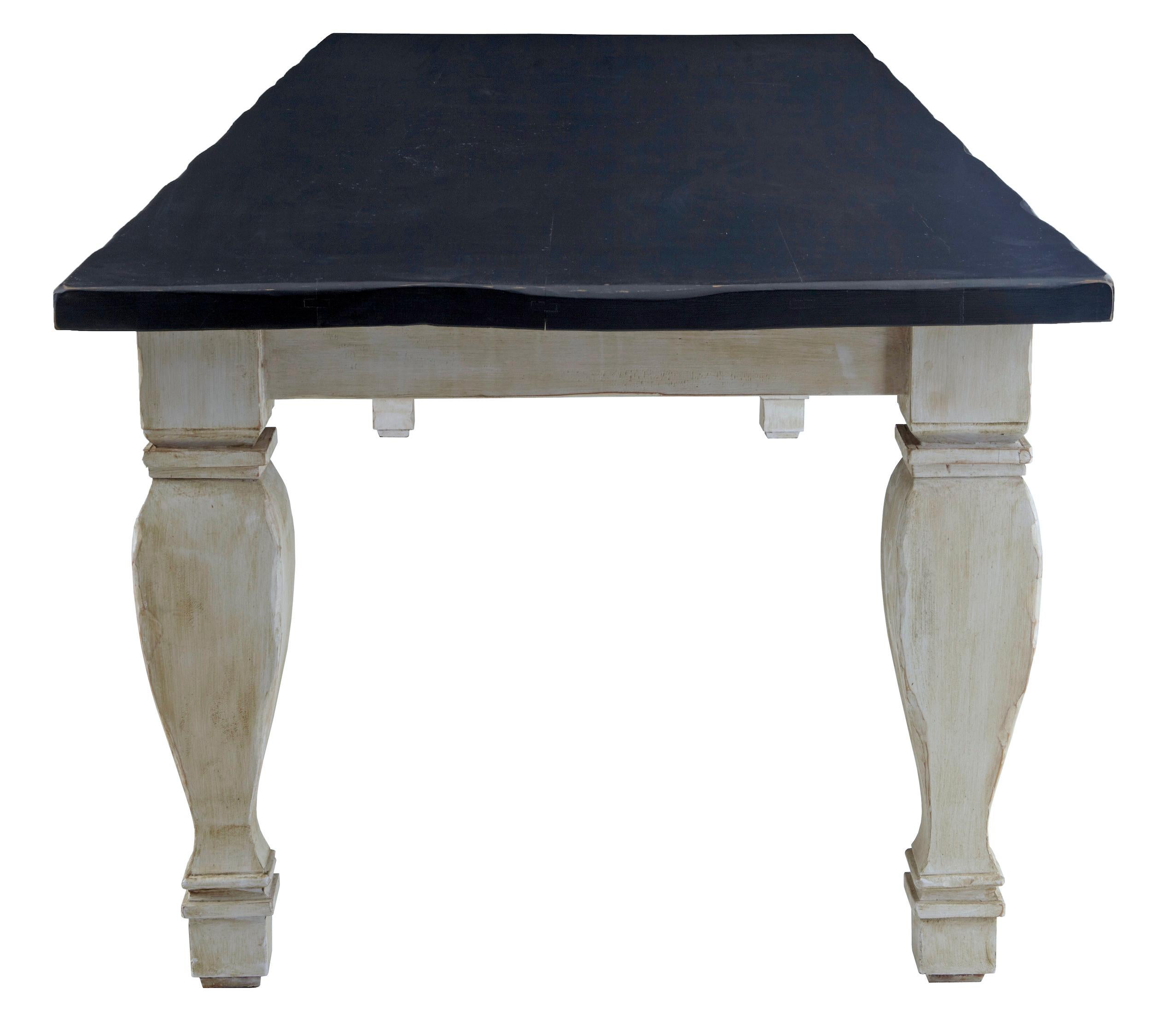 Carved hardwood rustic refectory table of large proportions, circa 1990.

At just over 3 meters long this is quite a substantial table, offering seating for 12+. Dark stained thick top with contrasting painted base in a white wash.

Expected