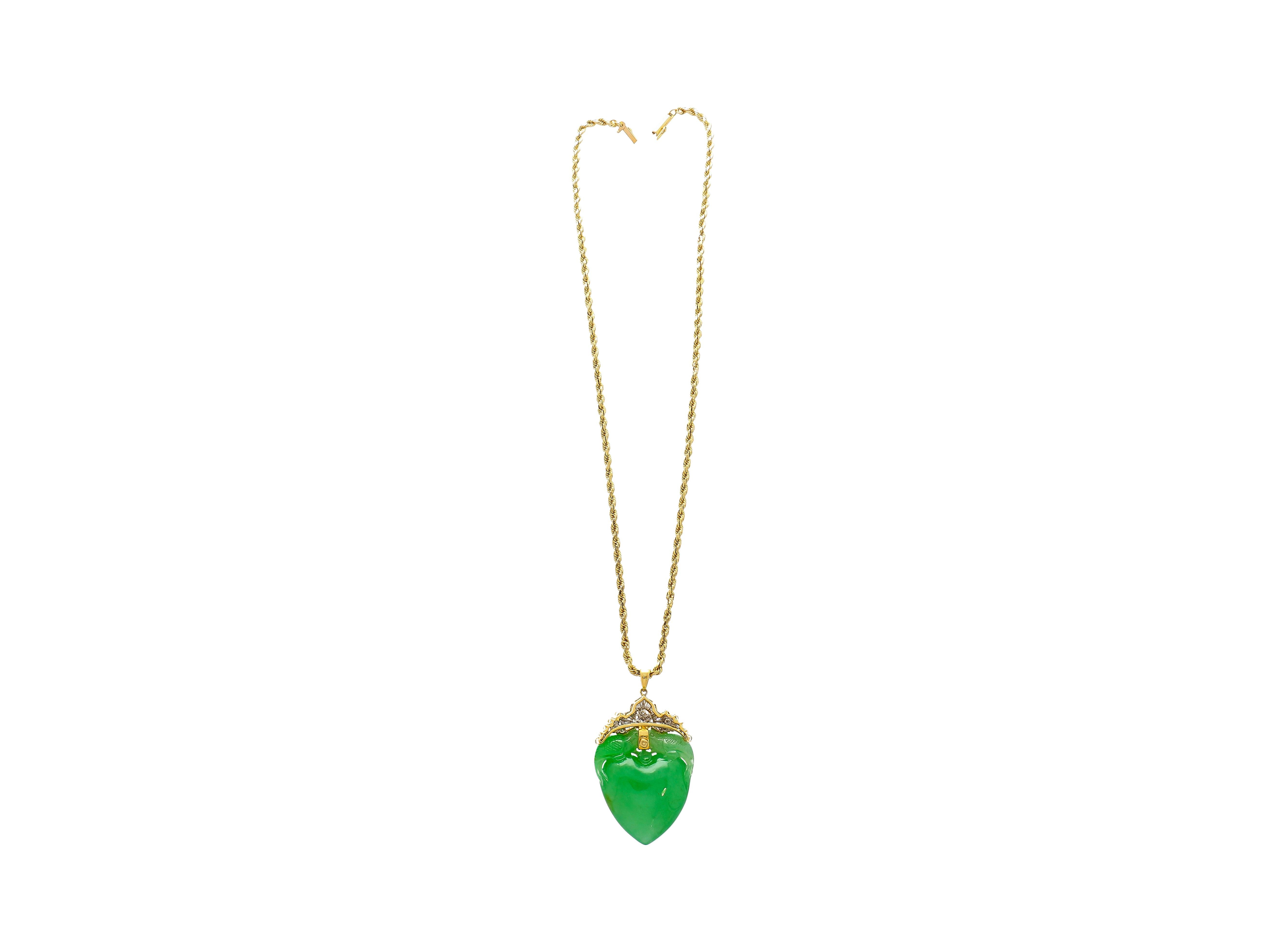 Discover a symbol of love and elegance with this Jadeite Jade pendant necklace. Crafted in 18K Yellow Gold, this exquisite piece showcases a heart-shaped carved green jade pendant, displaying a wonderful two-bird feeding motif carving. Symbolic of
