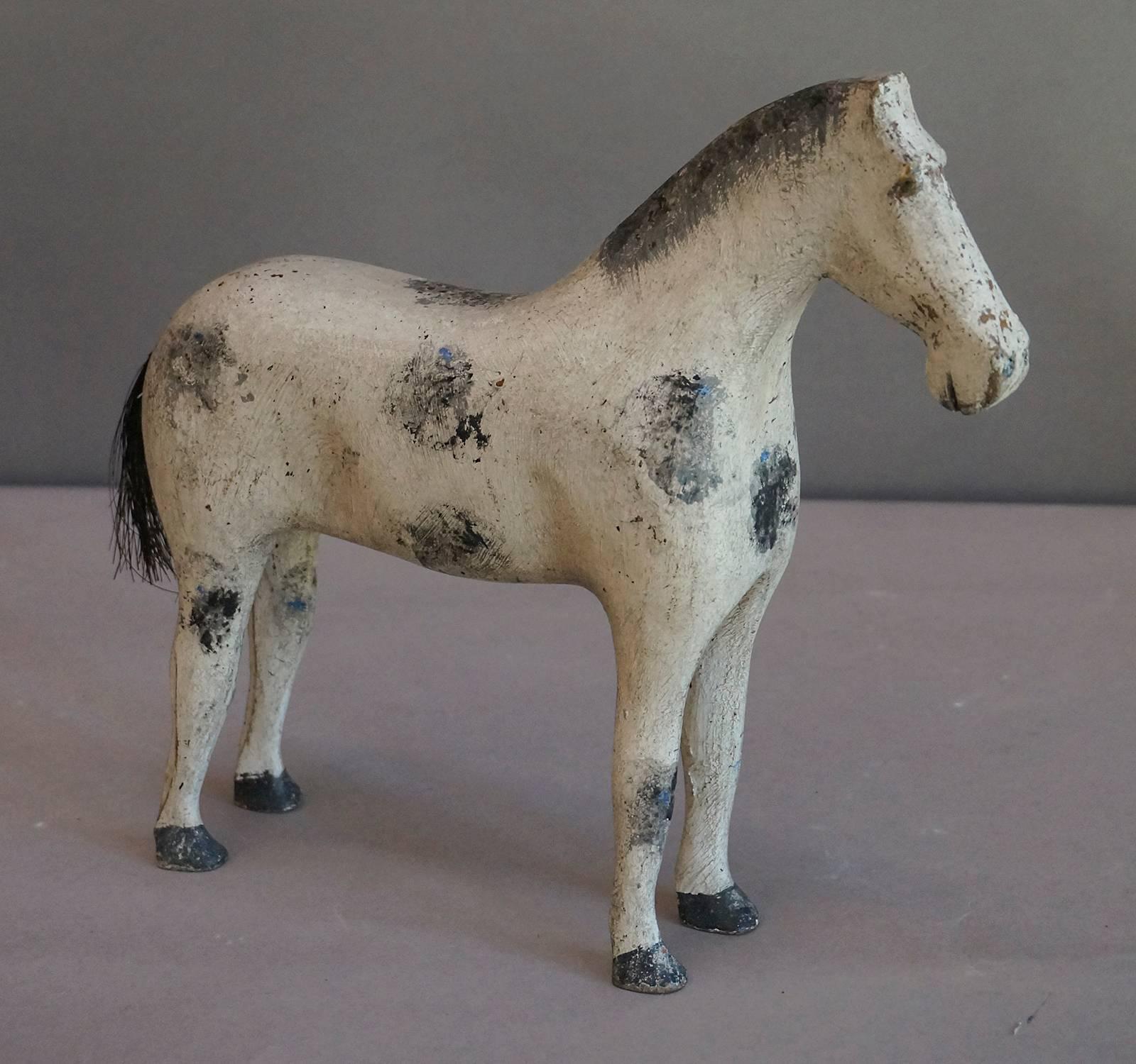 Toy horse, hand-carved in the north of Sweden circa 1880, with painted mane and horsehair tail. Not the most elegant steed, but this guy has the sweetest, most patient expression.