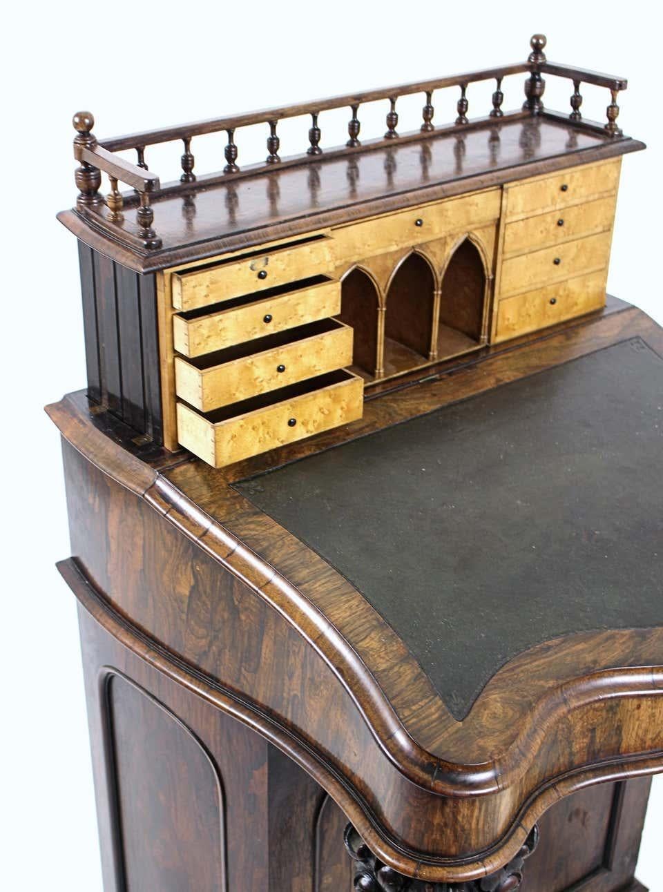 Early Victorian Carved Irish Rosewood and Leather Rise and Fall Davenport, circa 1850 For Sale