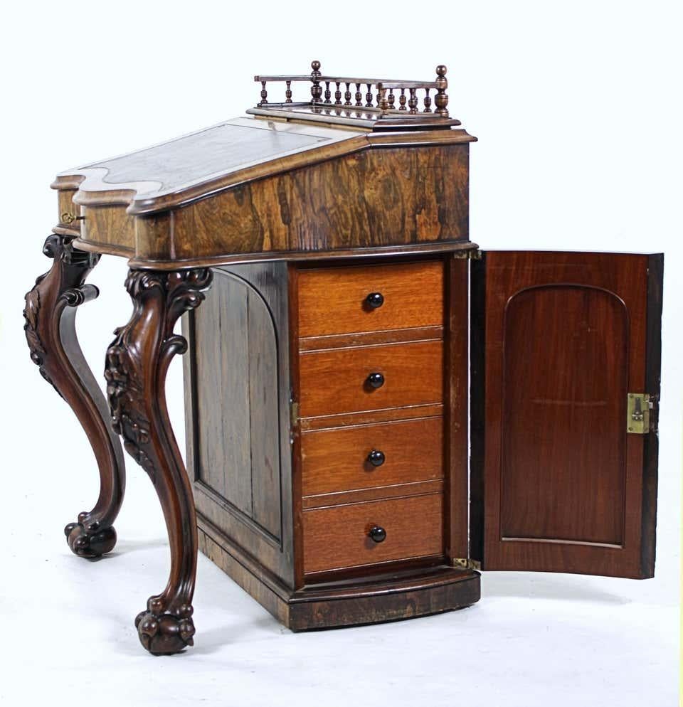 Mid-19th Century Carved Irish Rosewood and Leather Rise and Fall Davenport, circa 1850 For Sale