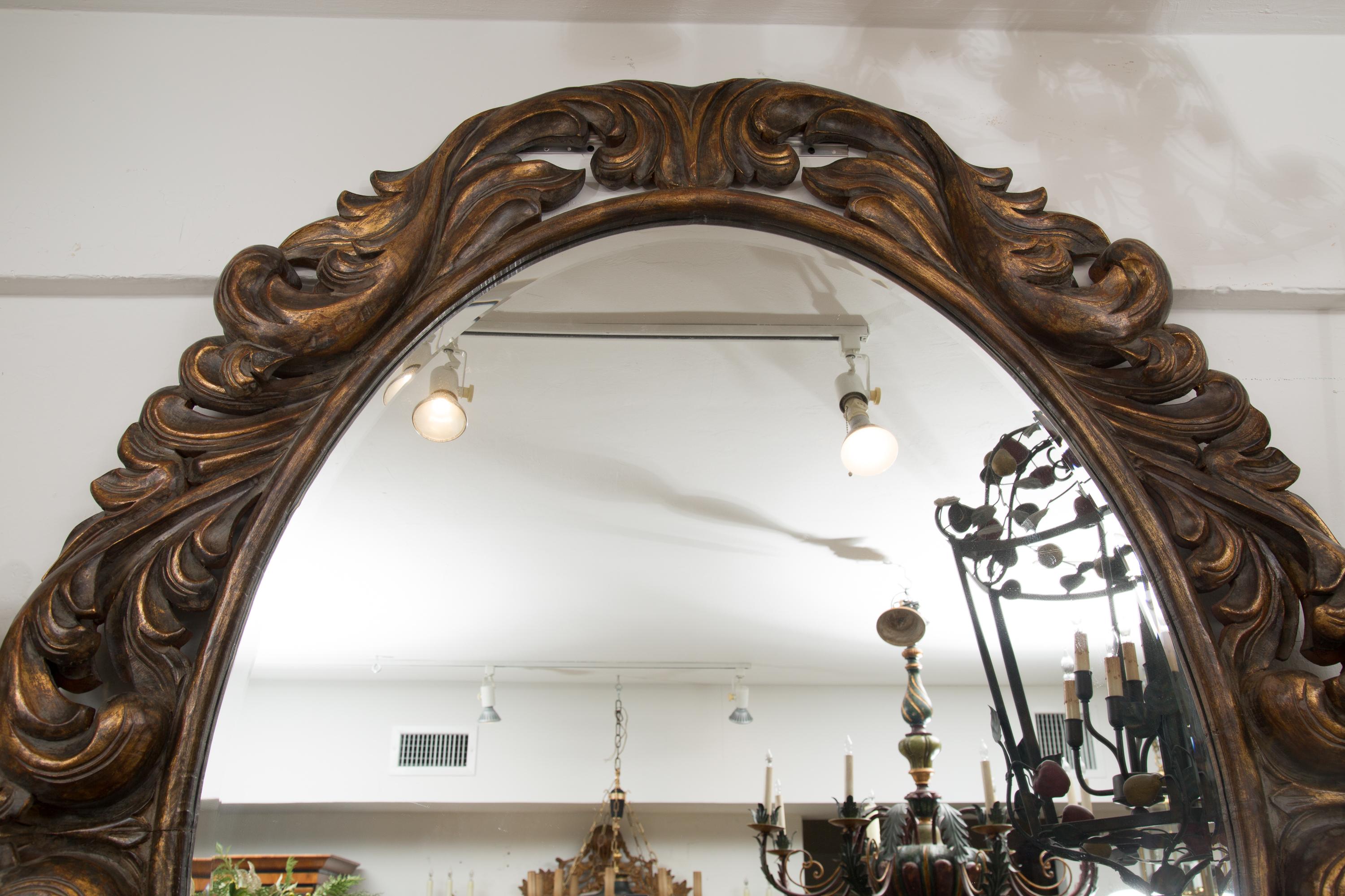 20th Century Carved Italian Oval Burnished Pine Mirror For Sale