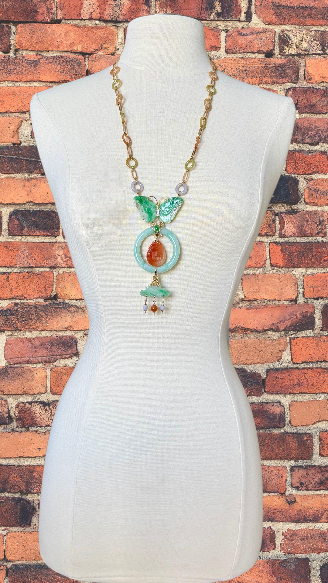 This vintage necklace features a rare combination of carved jade, diamonds, and 14K gold. The intricate carvings on the jade create a unique statement piece that is sure to turn heads. Elevate any outfit with this exquisite necklace.

Jewelry Type :