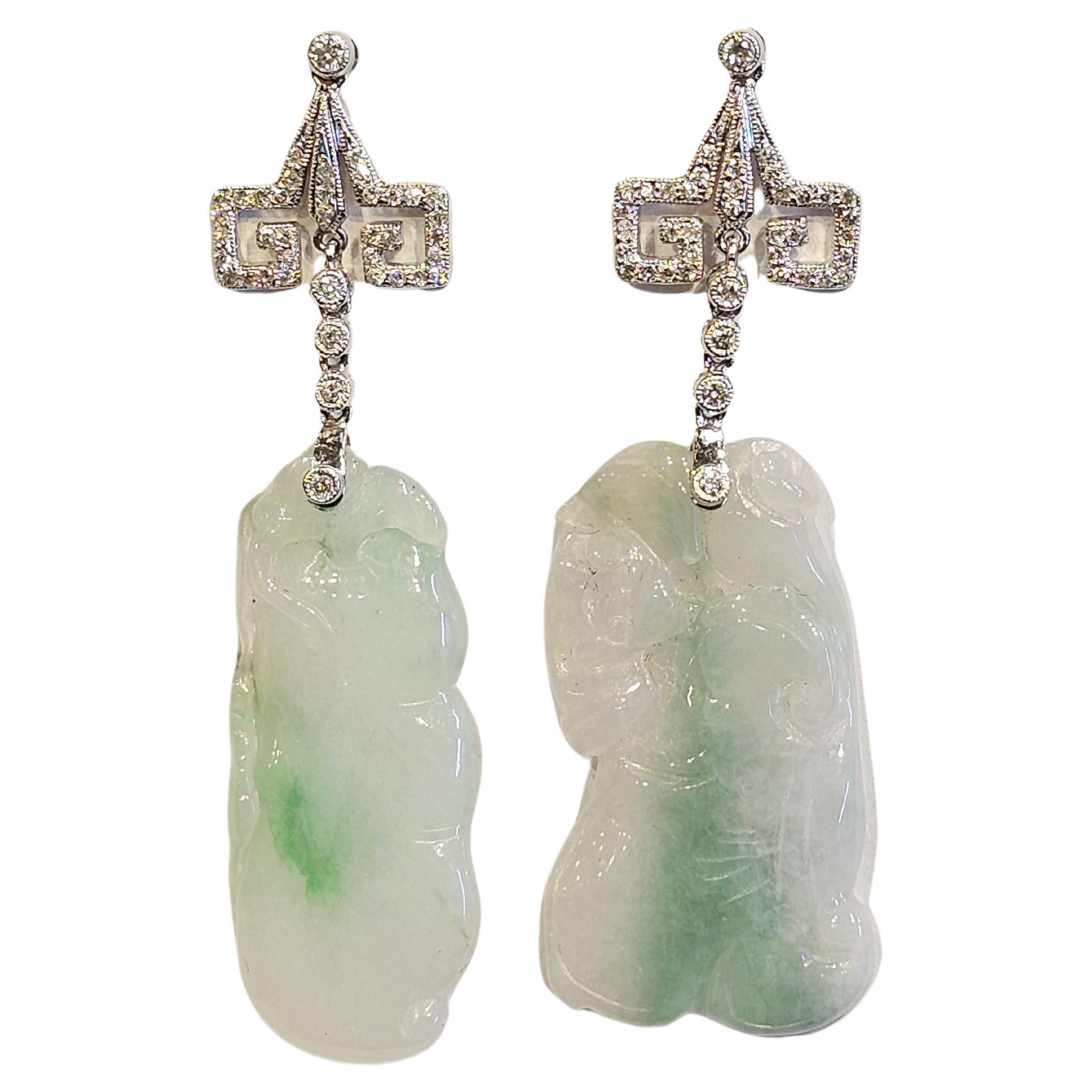 Carved Jade & Diamond Earrings

A pair of 18 karat white gold earrings set with approximately half a carat of round cut diamonds and 2 carved jade stones

Length: 2.38