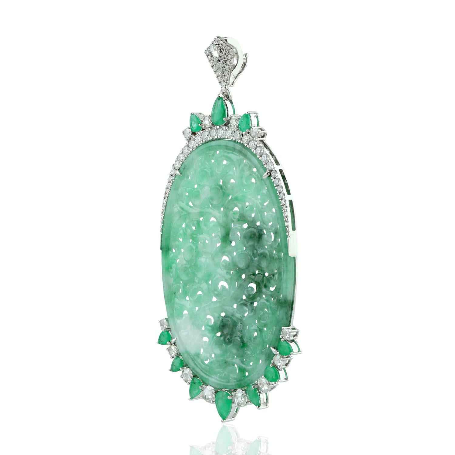 Cast in 18 Karat gold, this beautiful pendant features 35.47 carats of carved Jade, 1.92 carats emerald & 1.47 carats of sparkling diamonds.  

FOLLOW  MEGHNA JEWELS storefront to view the latest collection & exclusive pieces.  Meghna Jewels is