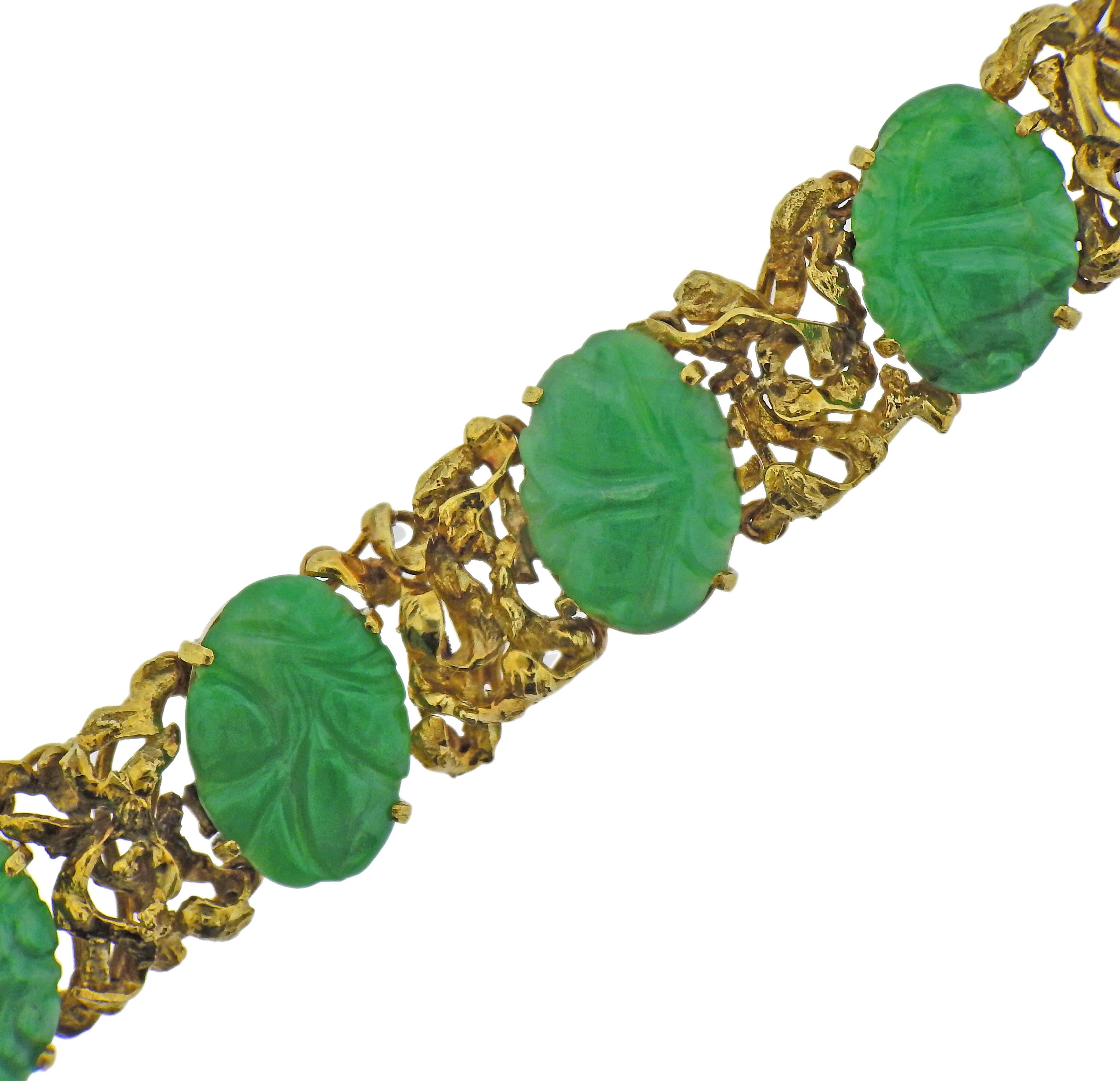 18k yellow gold bracelet with carved jade. Bracelet is 7