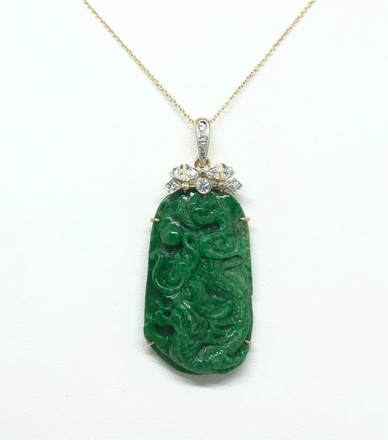 Jade 46.47 carats with Diamond 0.23 carat Pendant set in 18 Karat  Gold Settings
(chain not included)

Width: 2.1 cm 
Length: 5.0 cm
Total Weight: 12.5 grams

