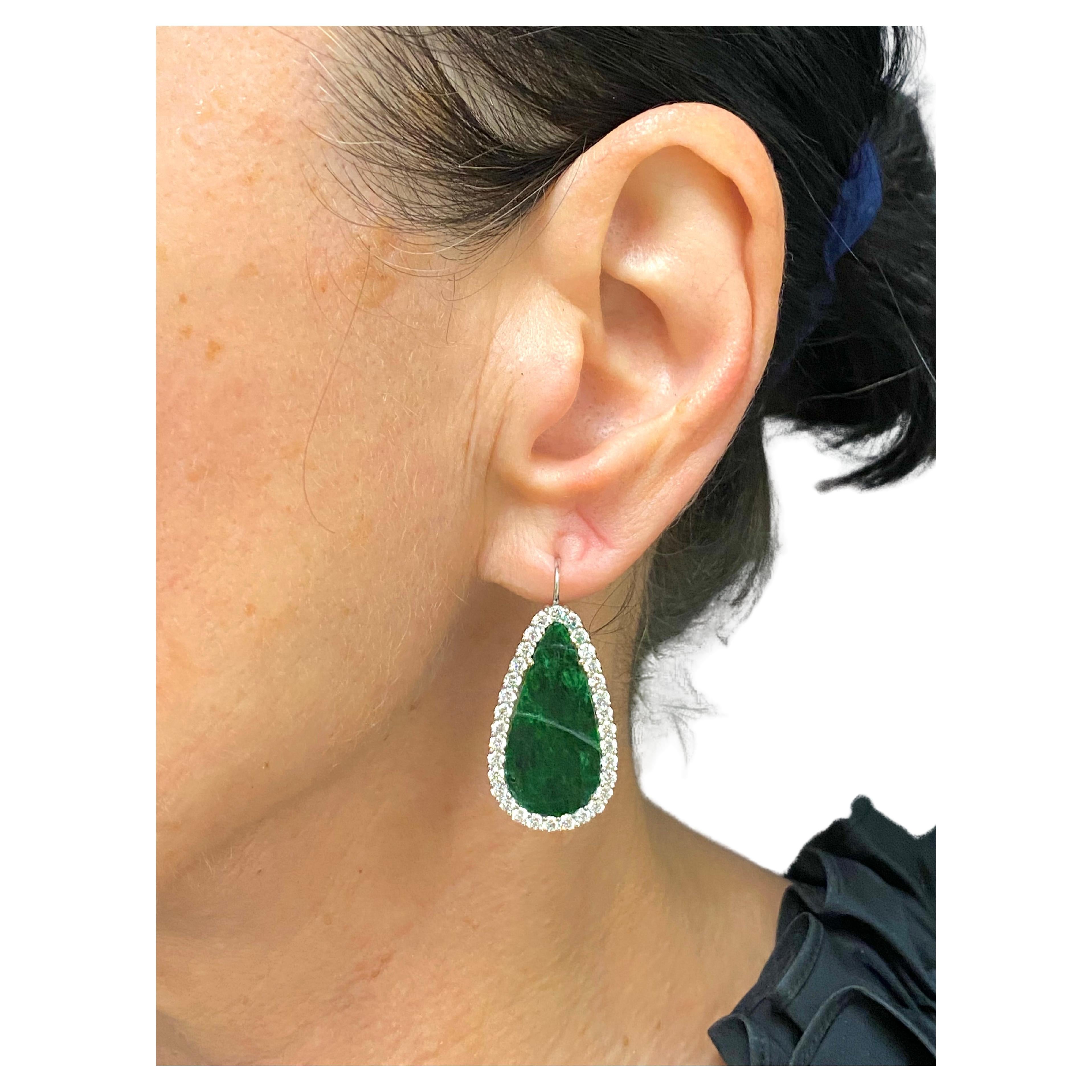 DESIGNER: Unknown
CIRCA: 1960s
MATERIALS: Rhodium-Plated 18K White Gold
GEMSTONE: Carved Jadeite, Diamond
WEIGHT: 11.1 grams
MEASUREMENT:  3/4