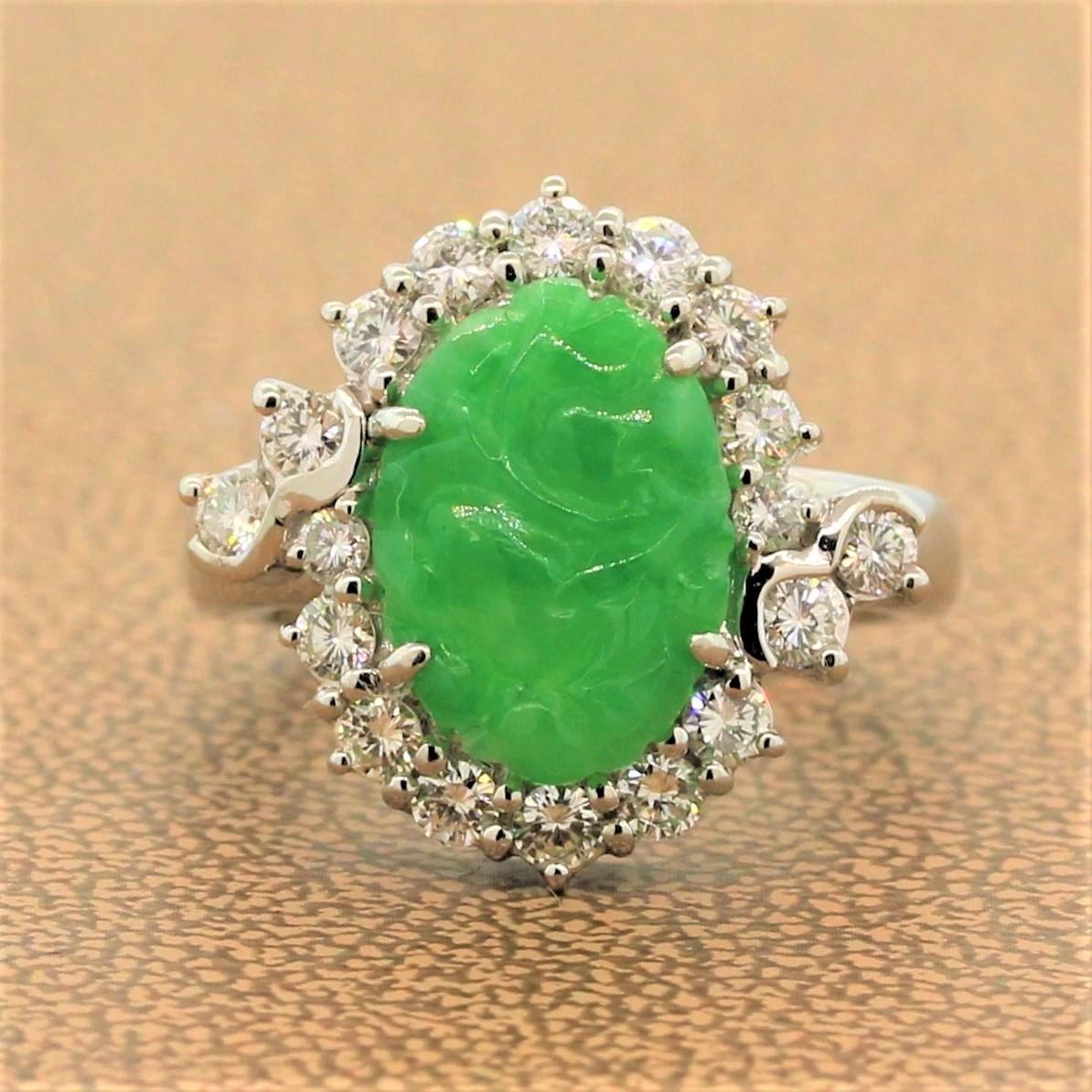 An exquisite ring featuring a 3.60 carat carved piece of natural jade. The oval shaped green jade is haloed by 0.83 carats of shimmering colorless round cut diamonds in a platinum setting.

Ring Size 5.50 (Sizable)
