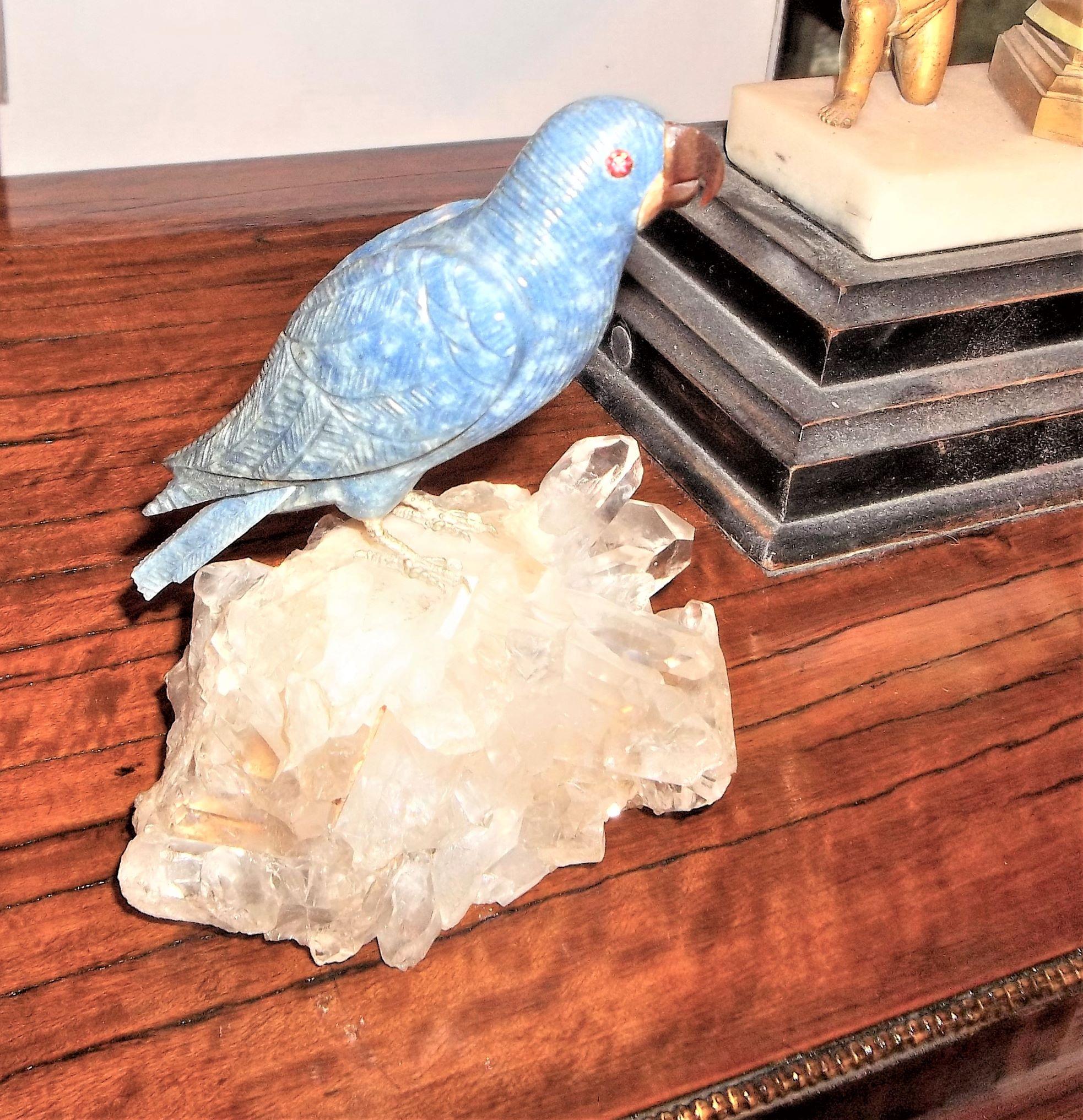 Carved lapis with hardstone beak atop a small but elaborate quartz base. Decorative and sturdy. Sturdy good condition. Typical 'dust of ages in carved parts and crystal quartz.
 