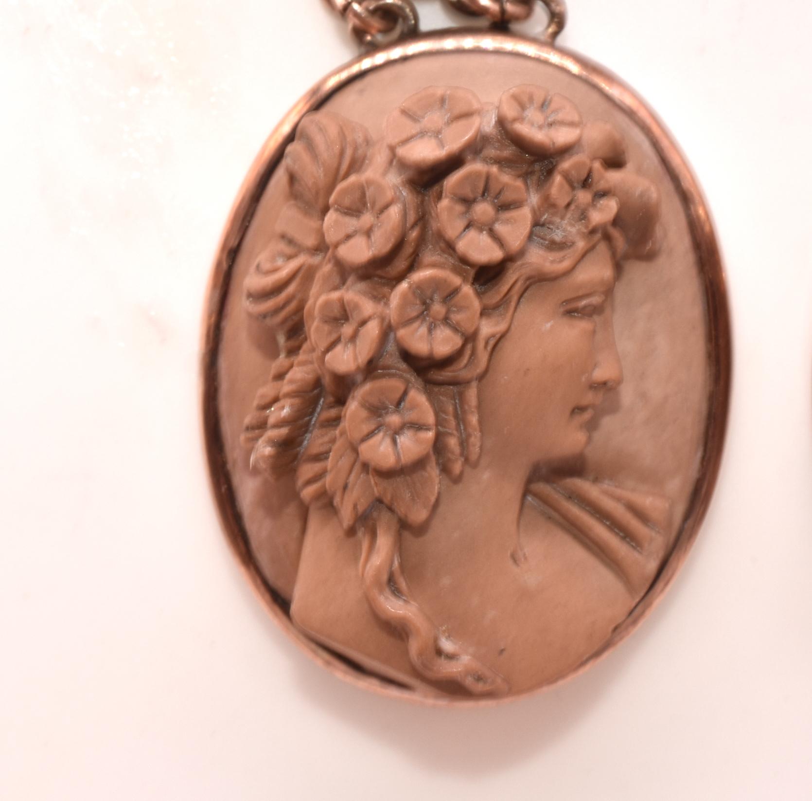 C1880 9K Victorian Lava Cameo earrings depicting Flora, the goddess of flowering plants, with the power to make flowers bloom and grow. The earrings possibly also depict a nymph bedecked with garlands of flowers. Both top and bottom cameos are