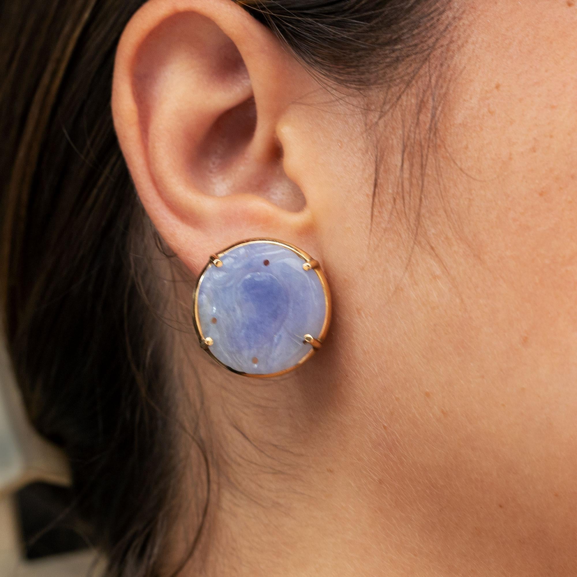 With a pleasing lavender color, these type A untreated natural jadeite jade earrings are the perfect celebration gift; responsible, elegant and naturally noteworthy. The pure, polished rounds feature stylistic hand carving, a lovely luster and clear