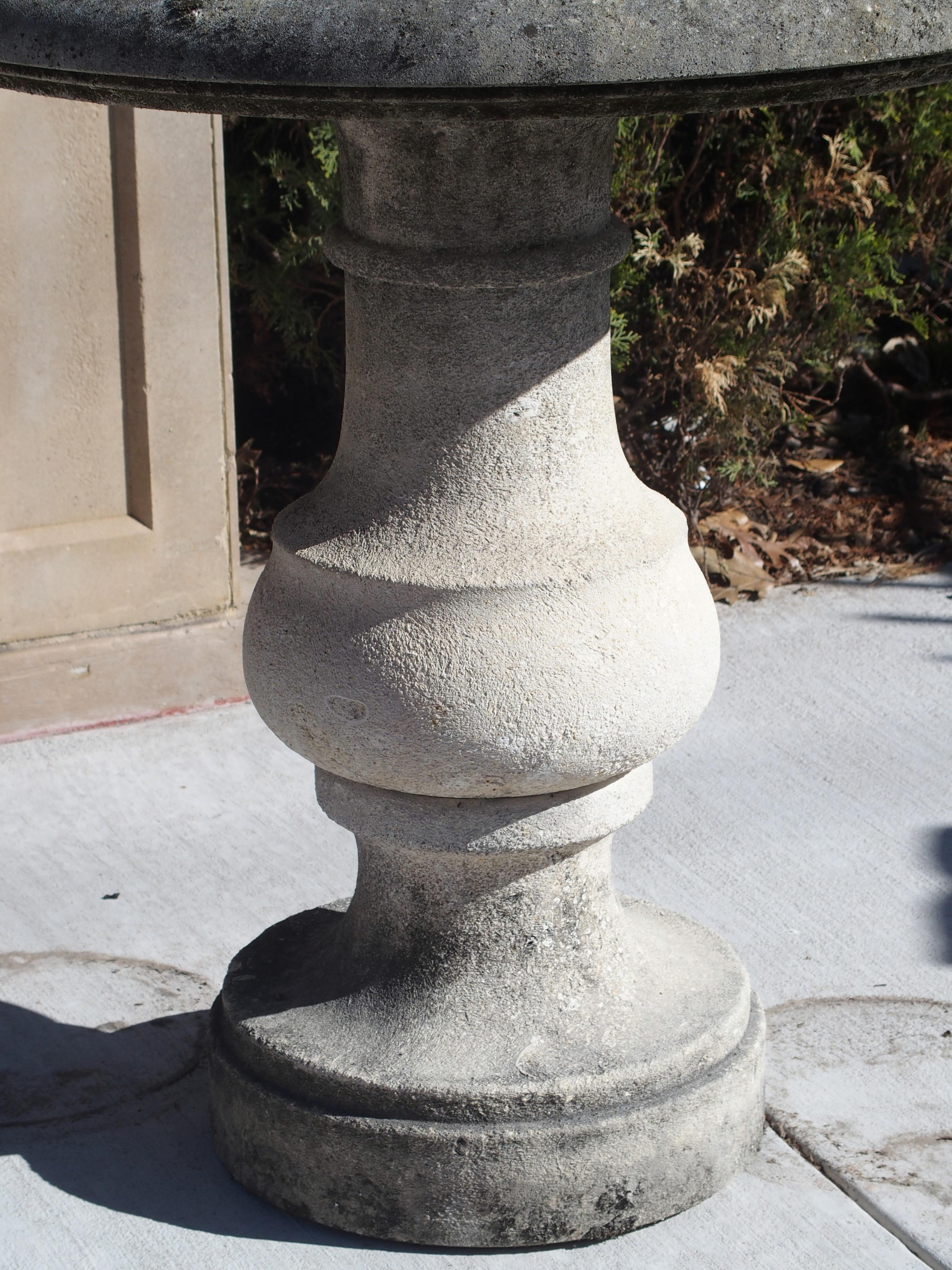 From Italy, this small, round, hand carved table has a single baluster pedestal with round base. The top piece has a nice quarter round molding. Perfect for indoors or outside, this charming stone table can be used as a bistro table, or side table.