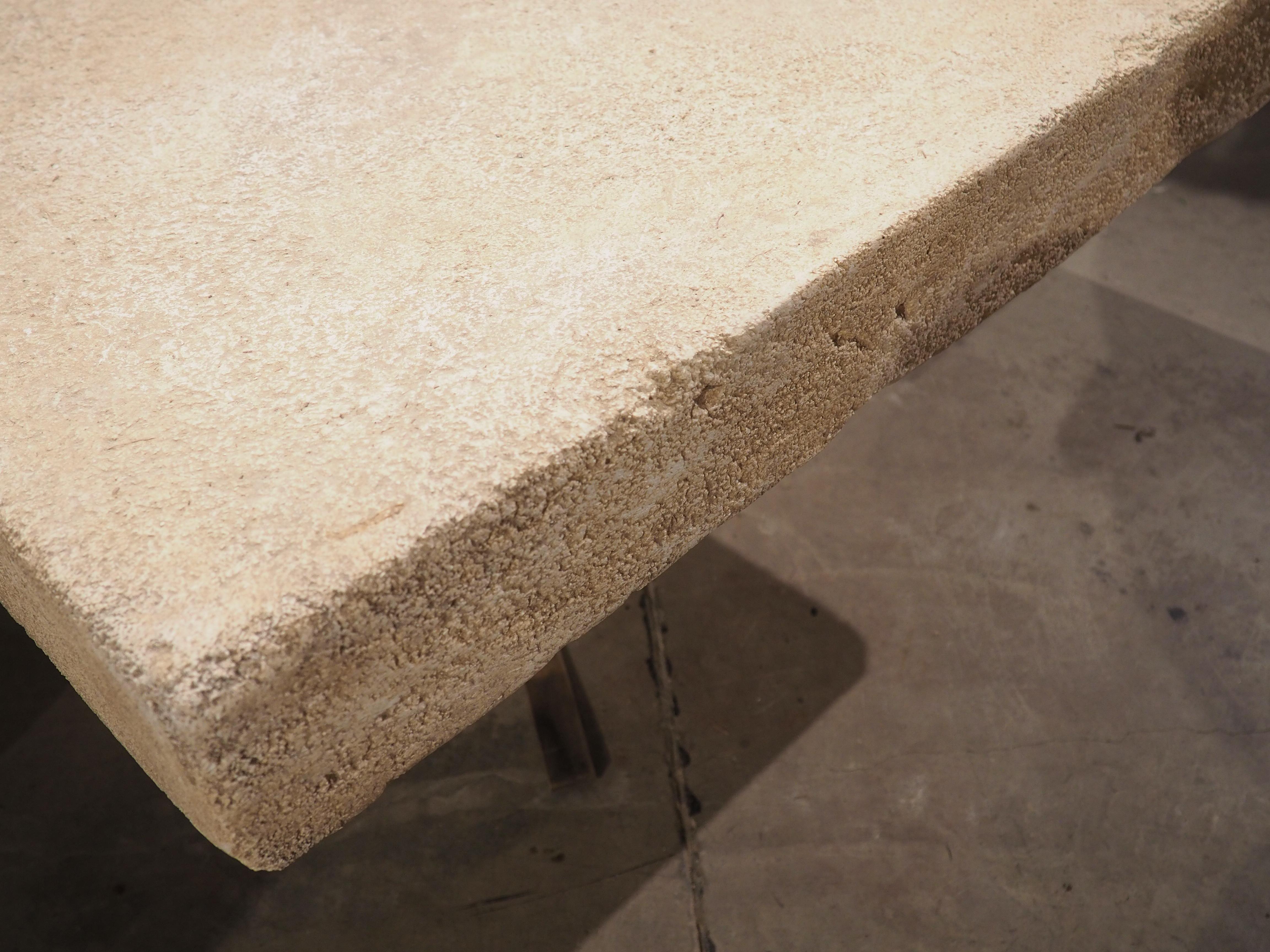 This versatile coffee table from the South of France has been hand-carved from the famous Estaillade stone of Provence. The top is one large piece of limestone (four inches thick), while the base is made from a separate block. This table can be used