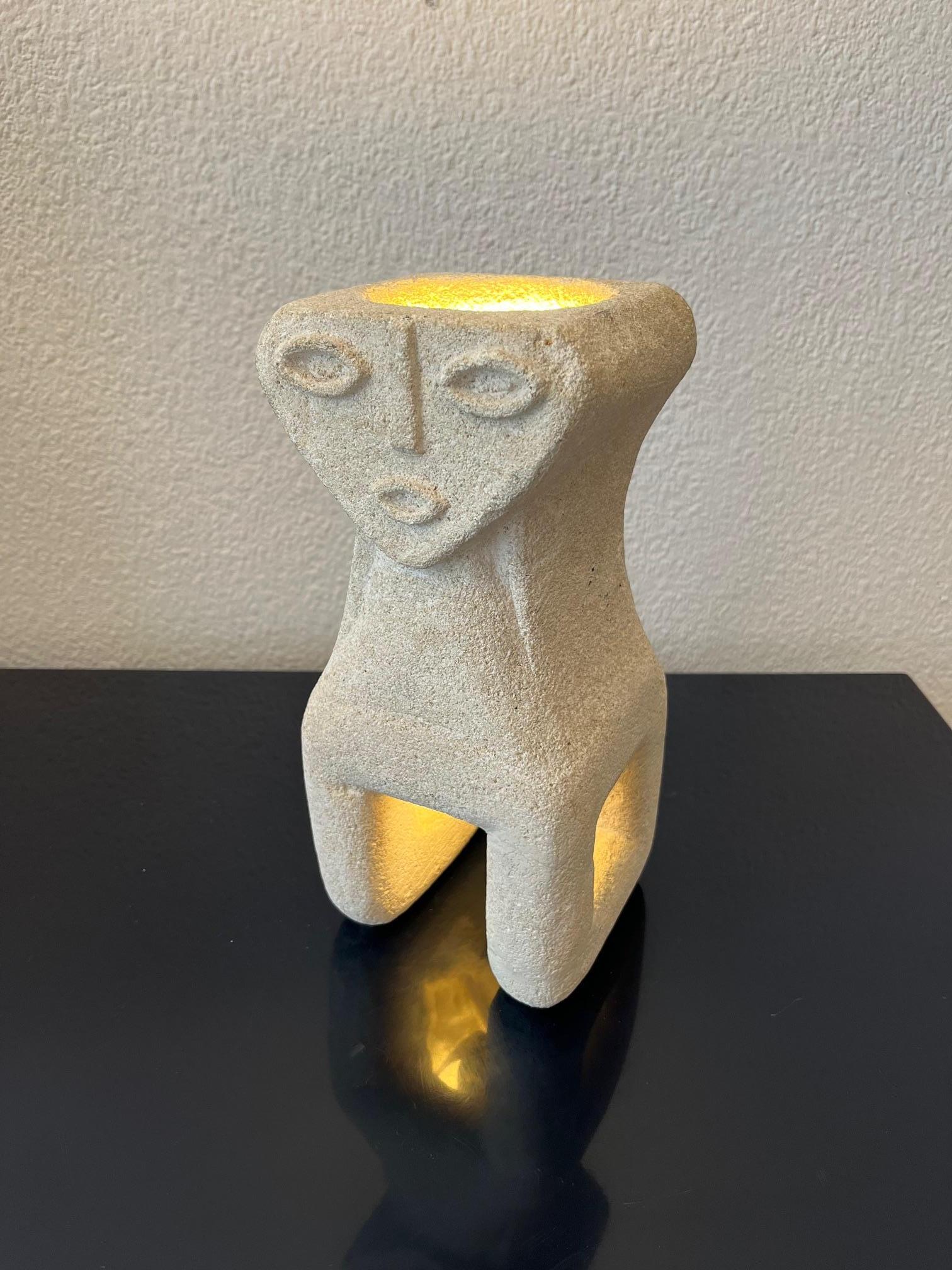 Hand Carved Limestone table lamp with a mystical triangular face by Albert Tormos, France ca. 1970s
Good condition. Restored at 2 places, at the bottom, see pictures.
Signed on the side ( pictures )

