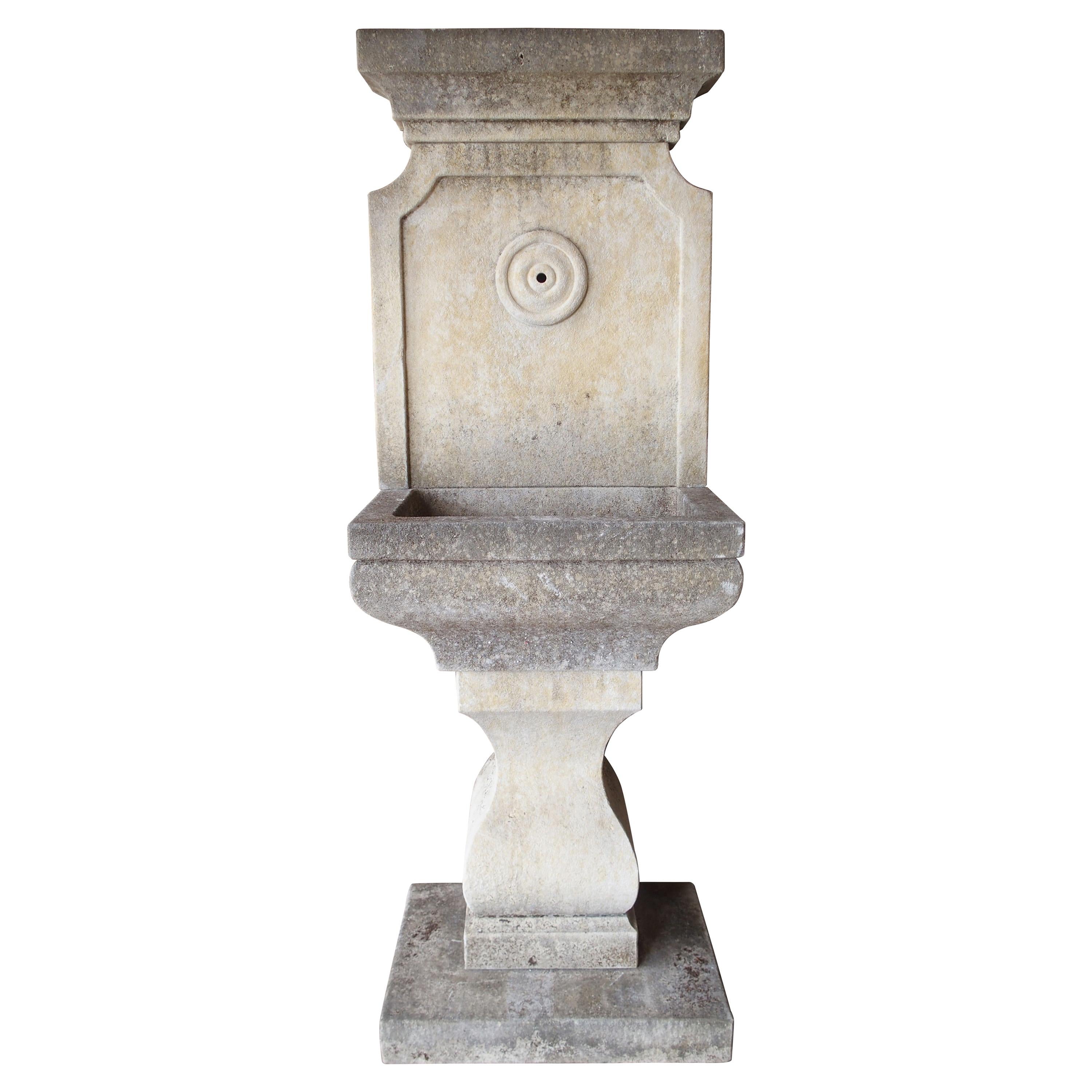 Small Carved Limestone Wall Fountain with Circular Basin at 1stDibs