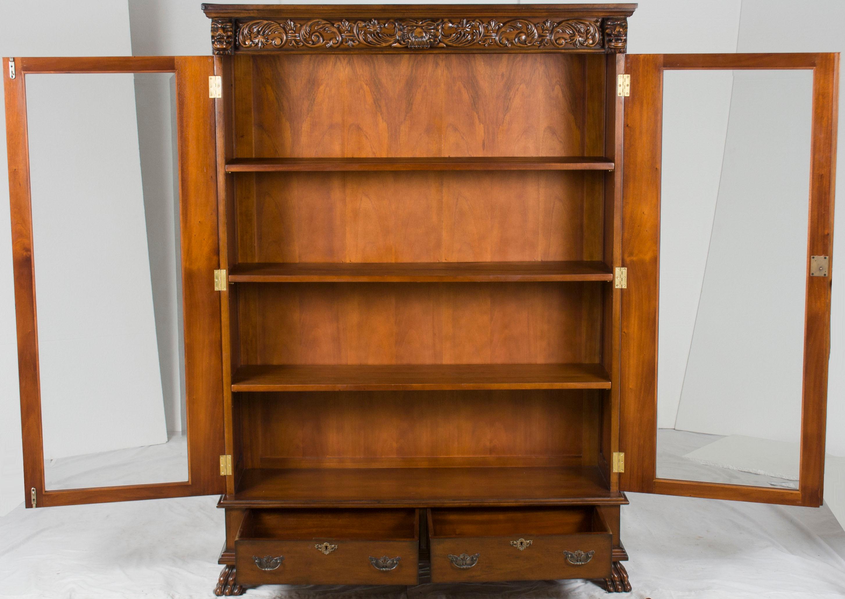 This carved mahogany glass door bookcase makes storing your books a stylish pleasure! This piece of furniture exudes style and charm by itself, and will look even better full of books!

The detailed carvings of this bookcase really help it stand