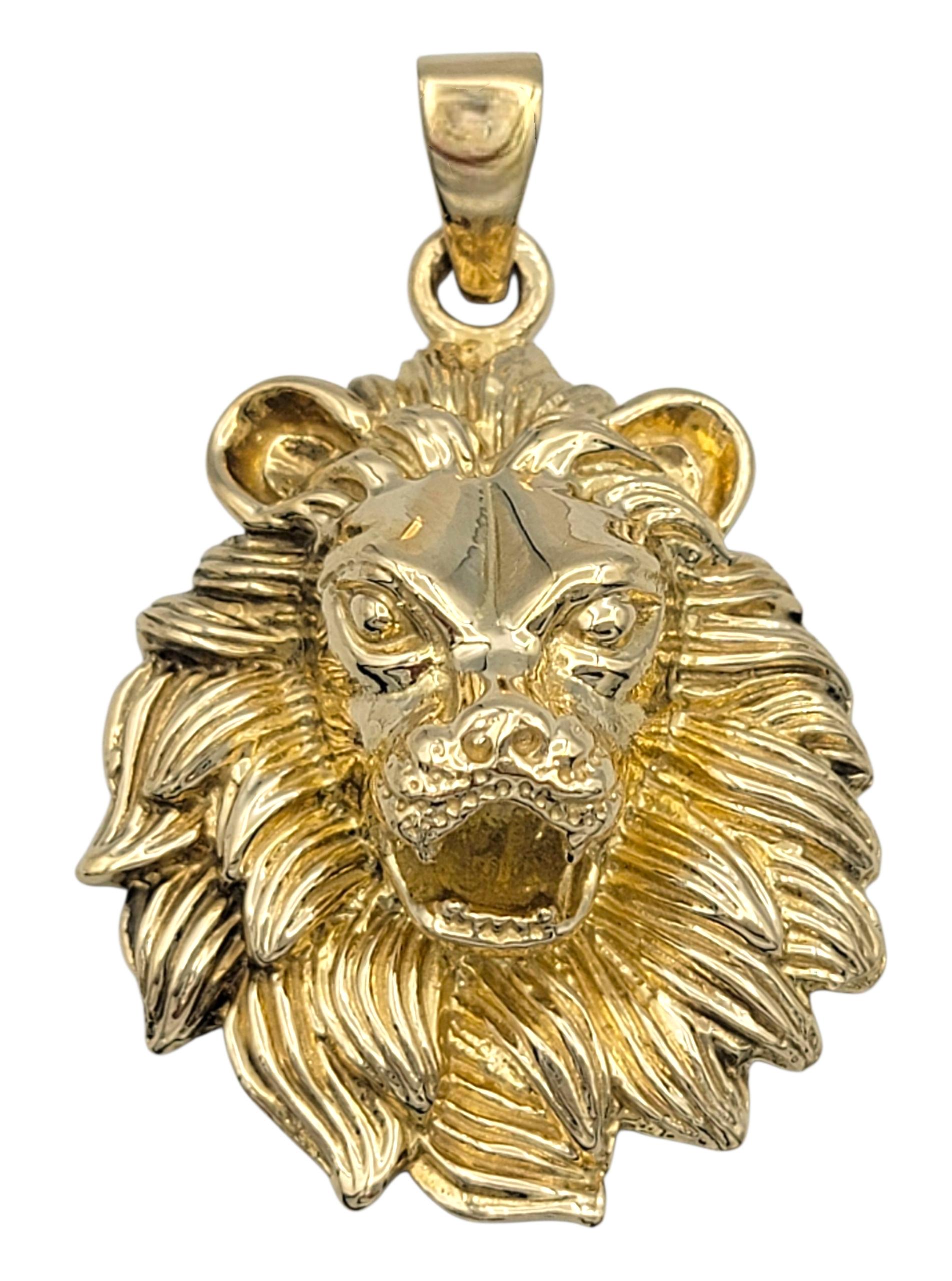 Bold and regal, this lion head pendant is a striking emblem of strength and confidence. Crafted in 14 karat yellow gold, the design captures the fierce expression and flowing mane of the King of the jungle with detailed texture and dimensional
