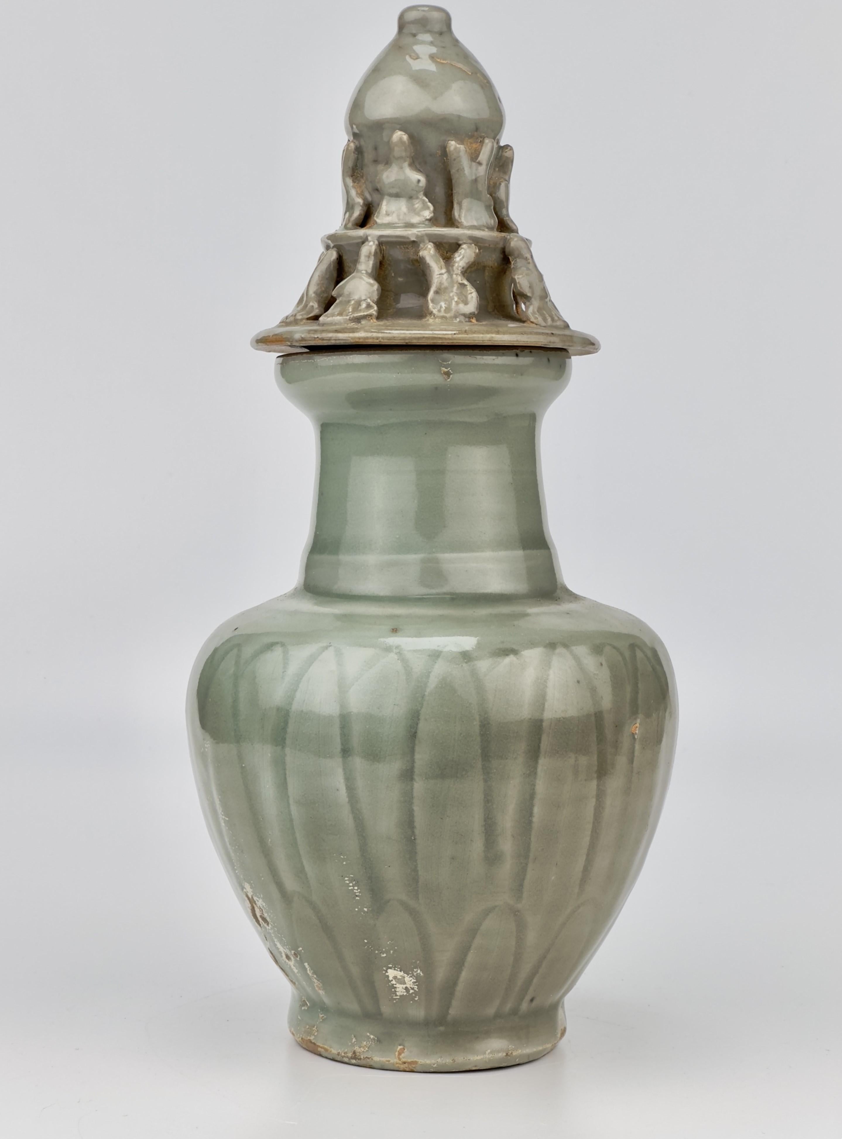 Ming Carved 'Longquan' Celadon-glazed Funerary vase and cover, Song dynasty For Sale