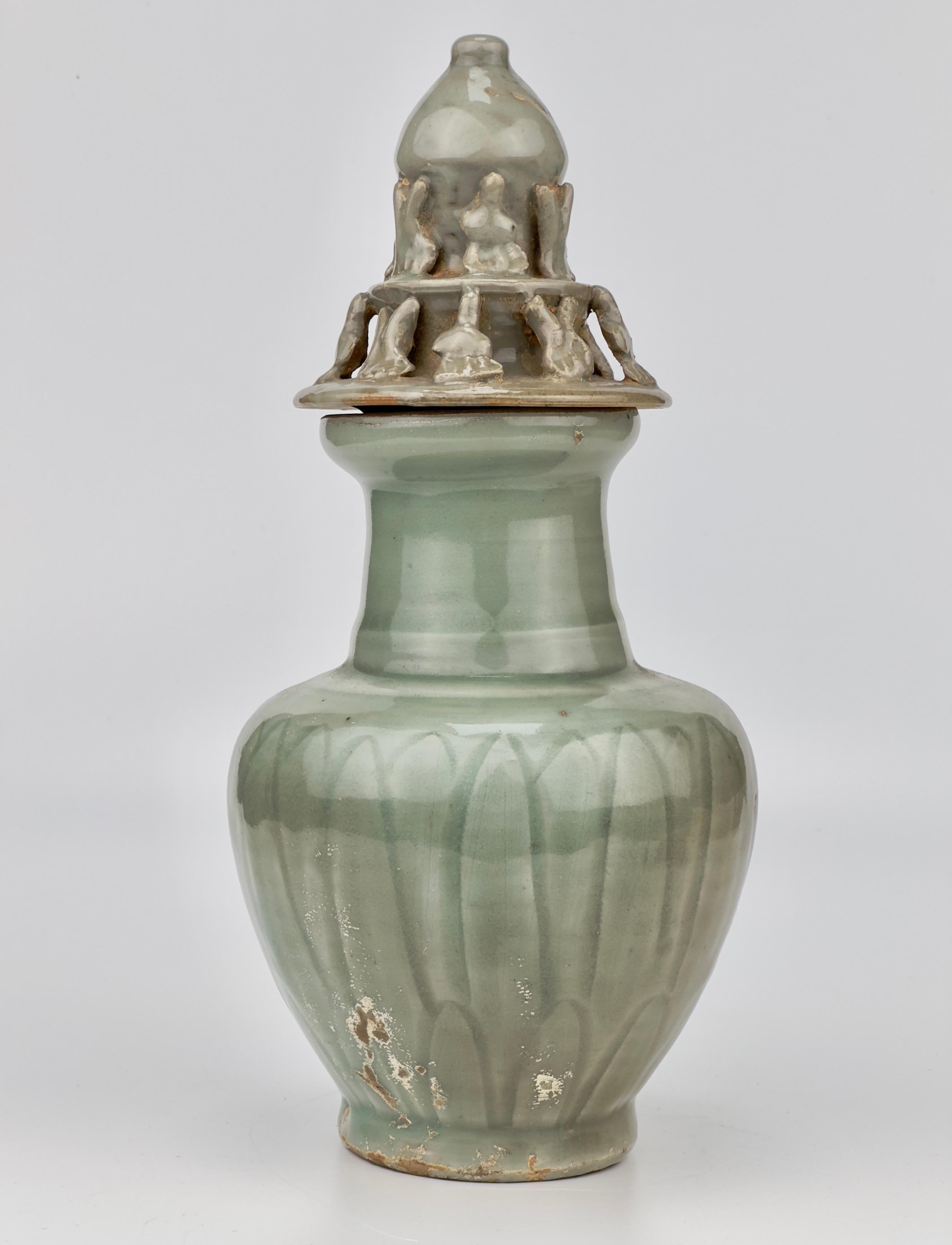 Glazed Carved 'Longquan' Celadon-glazed Funerary vase and cover, Song dynasty For Sale