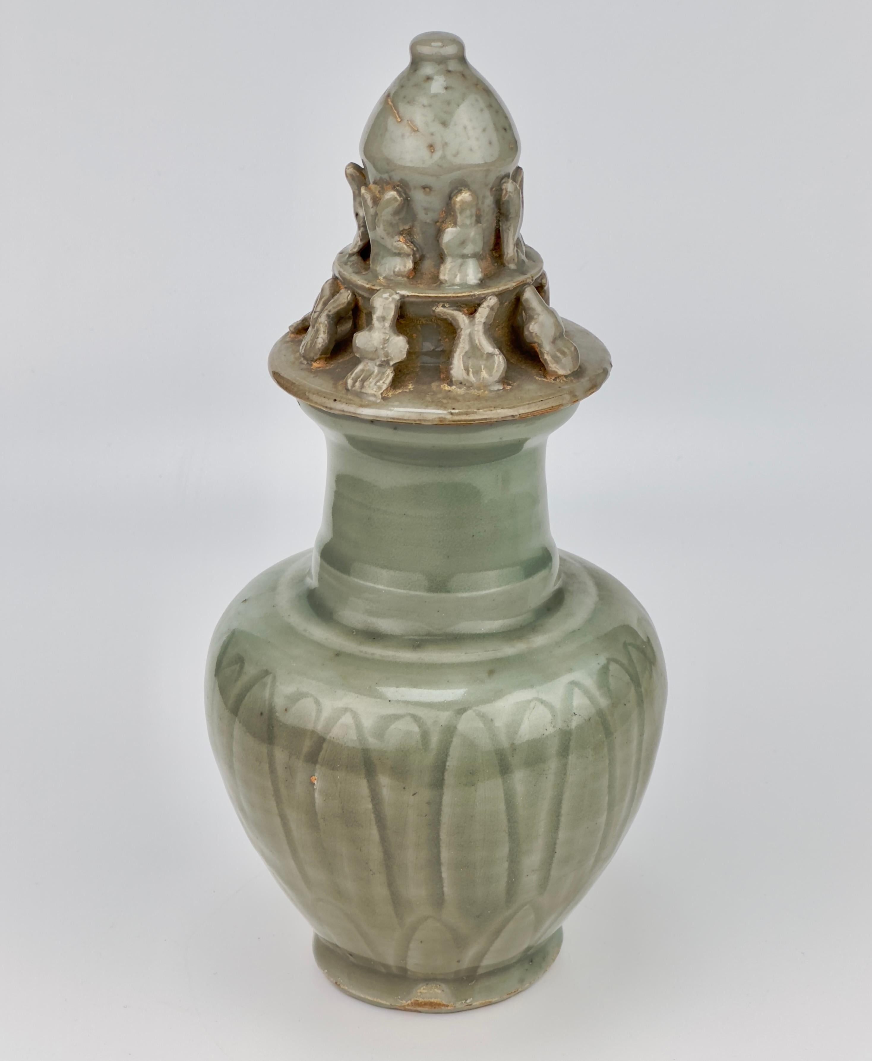 Glazed Carved 'Longquan' Celadon-glazed Funerary vase and cover, Song dynasty For Sale