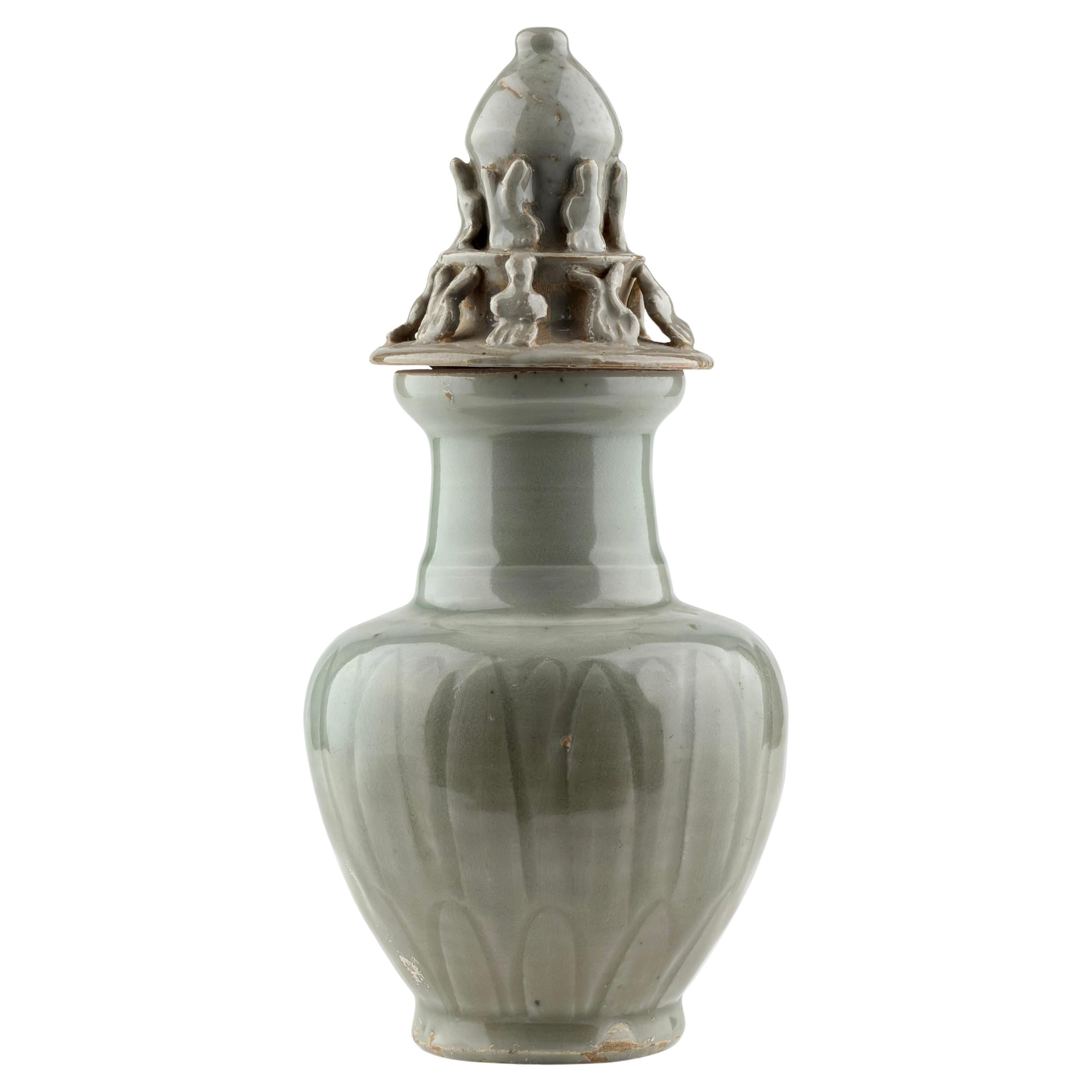 Carved 
Longquan
 Celadon-glazed Funerary vase and cover, Song dynasty