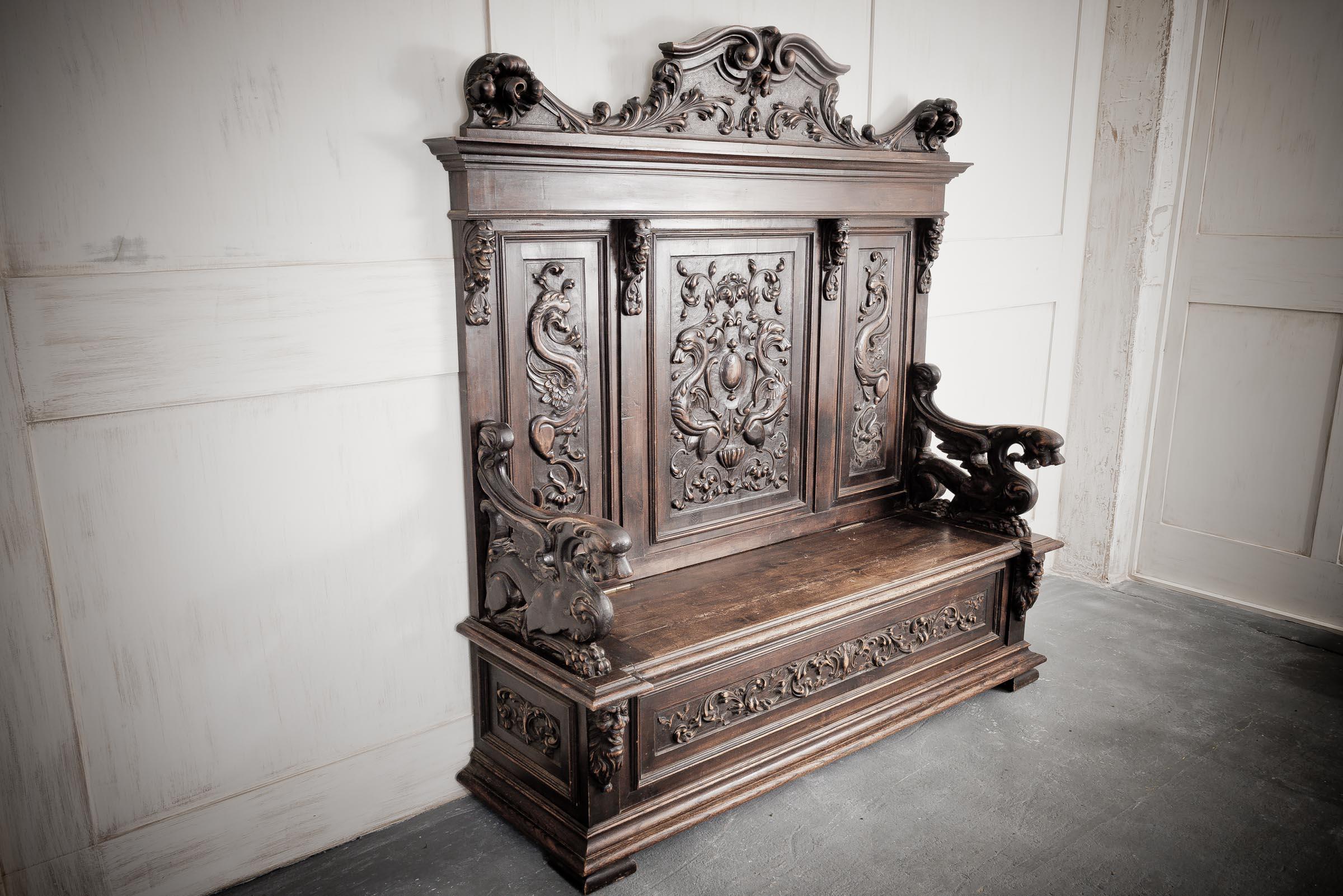 Carved Louis XVIII French Chateau settle dating from early 19th century. Also referred to as a monks bench this fine example carries a wonderfully aged and worn look in all the right places with a delightful patina showing the age and history