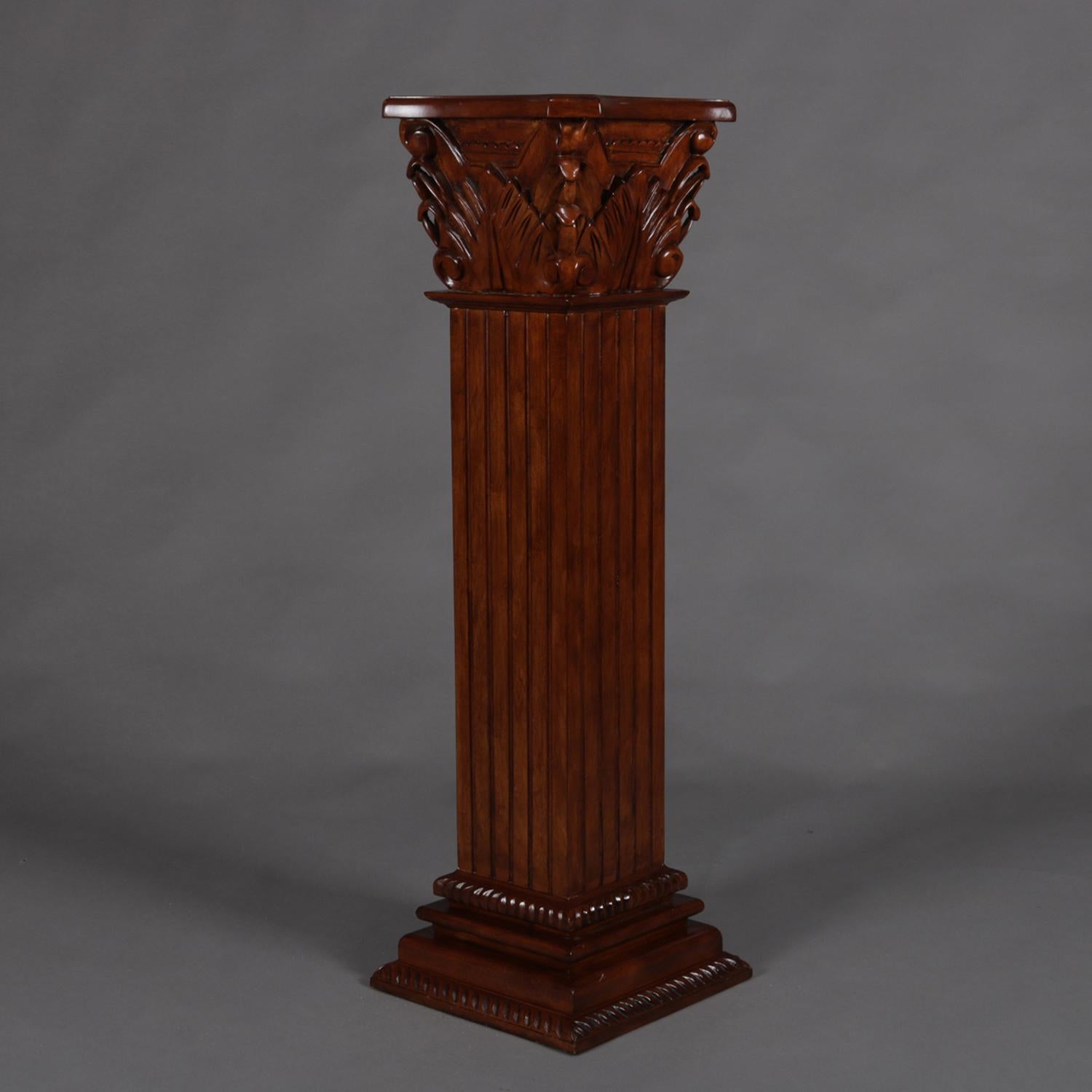 Mahogany sculpture display stand features carved mahogany construction in square Greek Corinthian column form with reeded shaft having stepped base and acanthus capital with display having inset marble, 20th century

Measures: 42