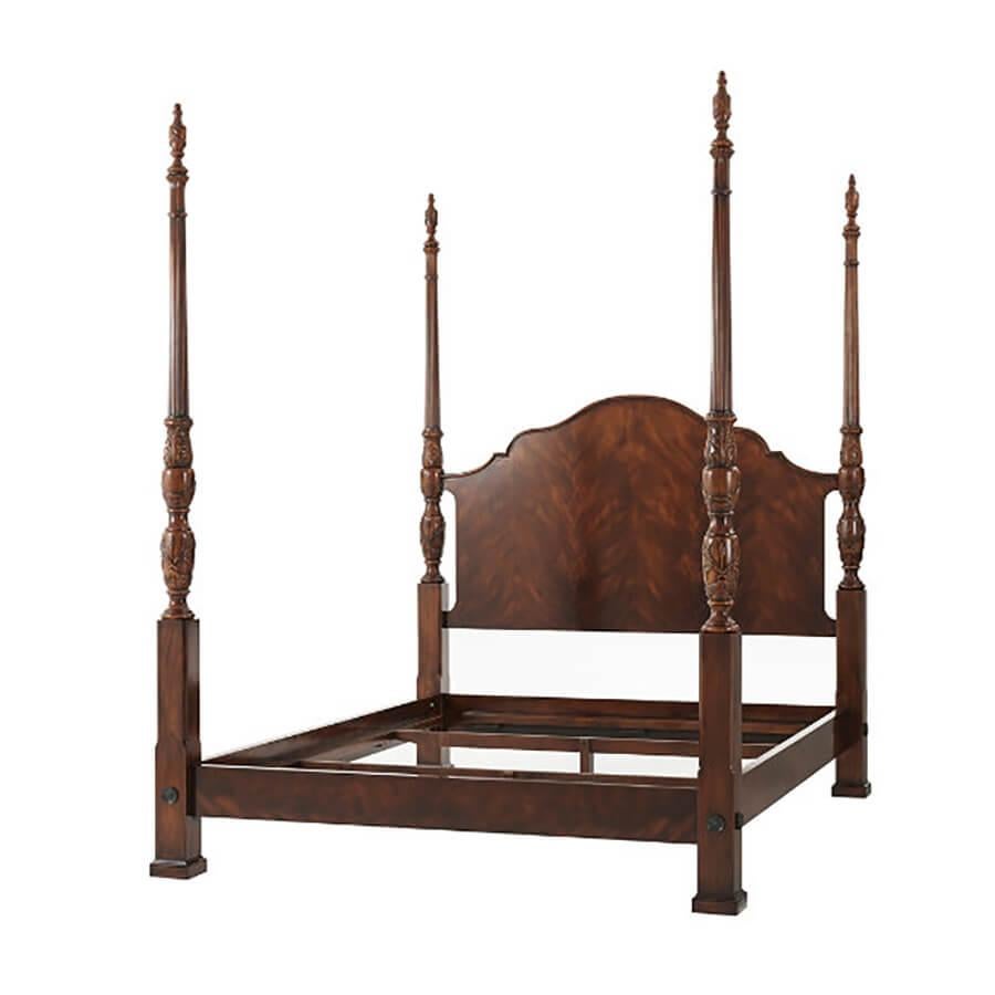 A finely carved mahogany and figured mahogany Queen bed, the serpentine arched and molded edge headboard flanked by acanthus leaf and rice carved baluster turned posts with urn finials, the figured mahogany rails with brass rosettes to the posts.