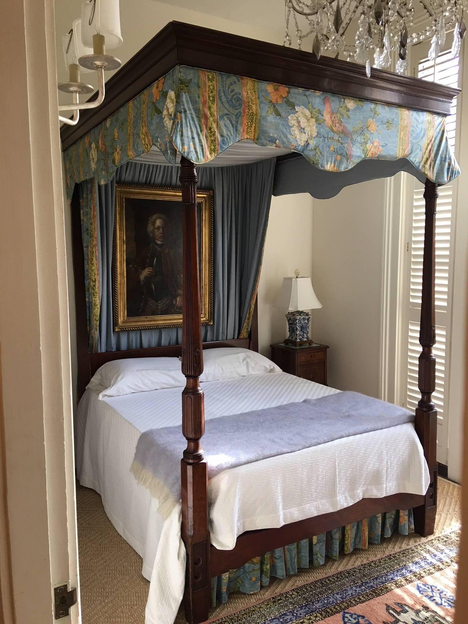 Carved mahogany four-poster bed with canopy, 19th century. Custom mattress. Bedding not included.  Mattress size is 71