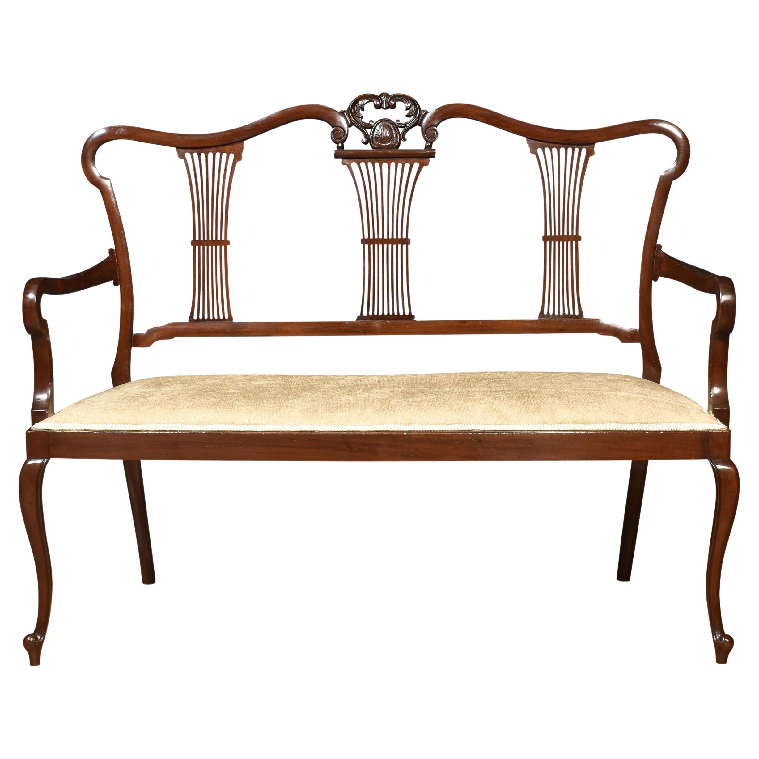 Carved mahogany framed settee