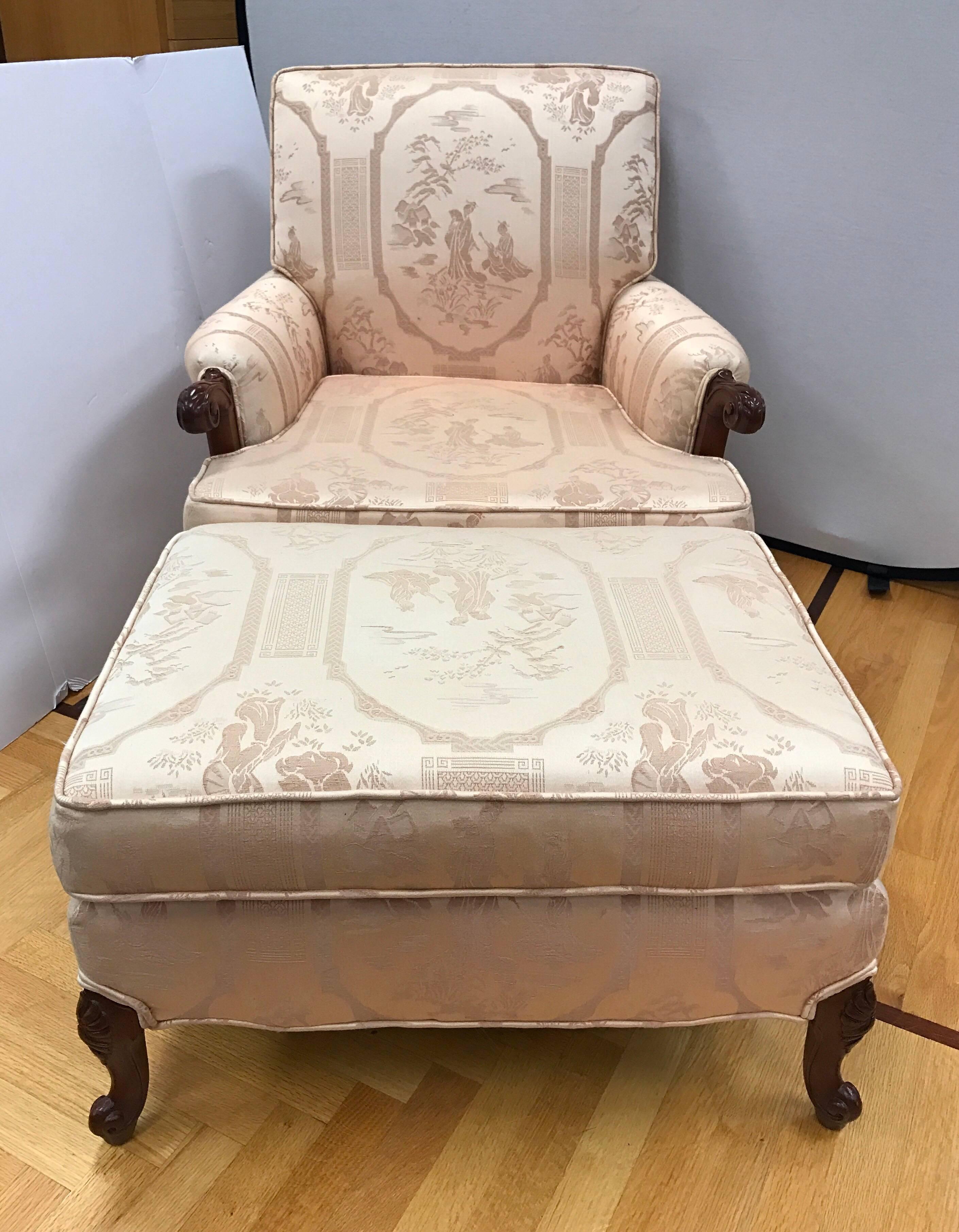Vintage carved chair and matching ottoman with original fabric which is a light pink chinoiserie fabric. 
