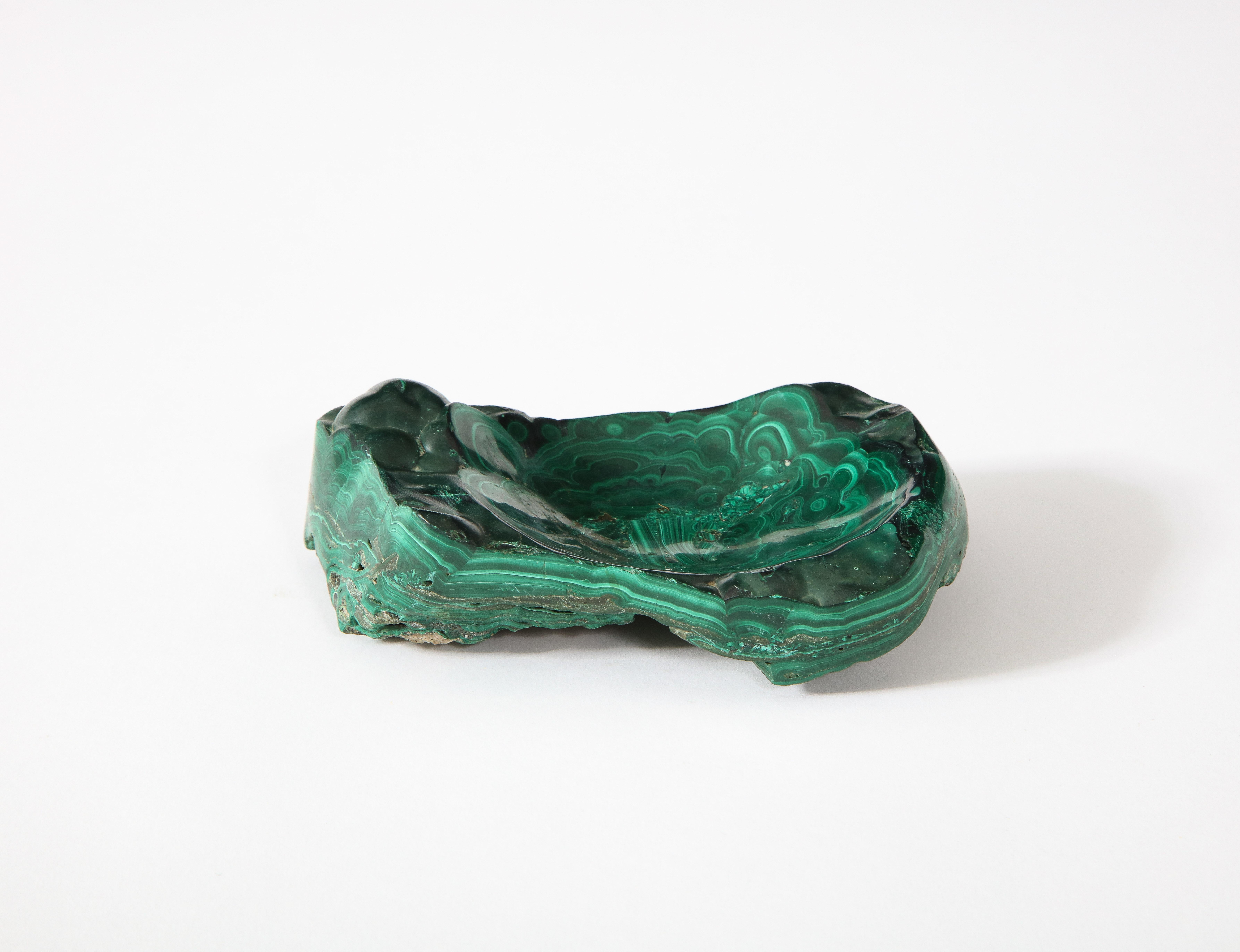 An elegant vide poche carved out of solid Malachite.