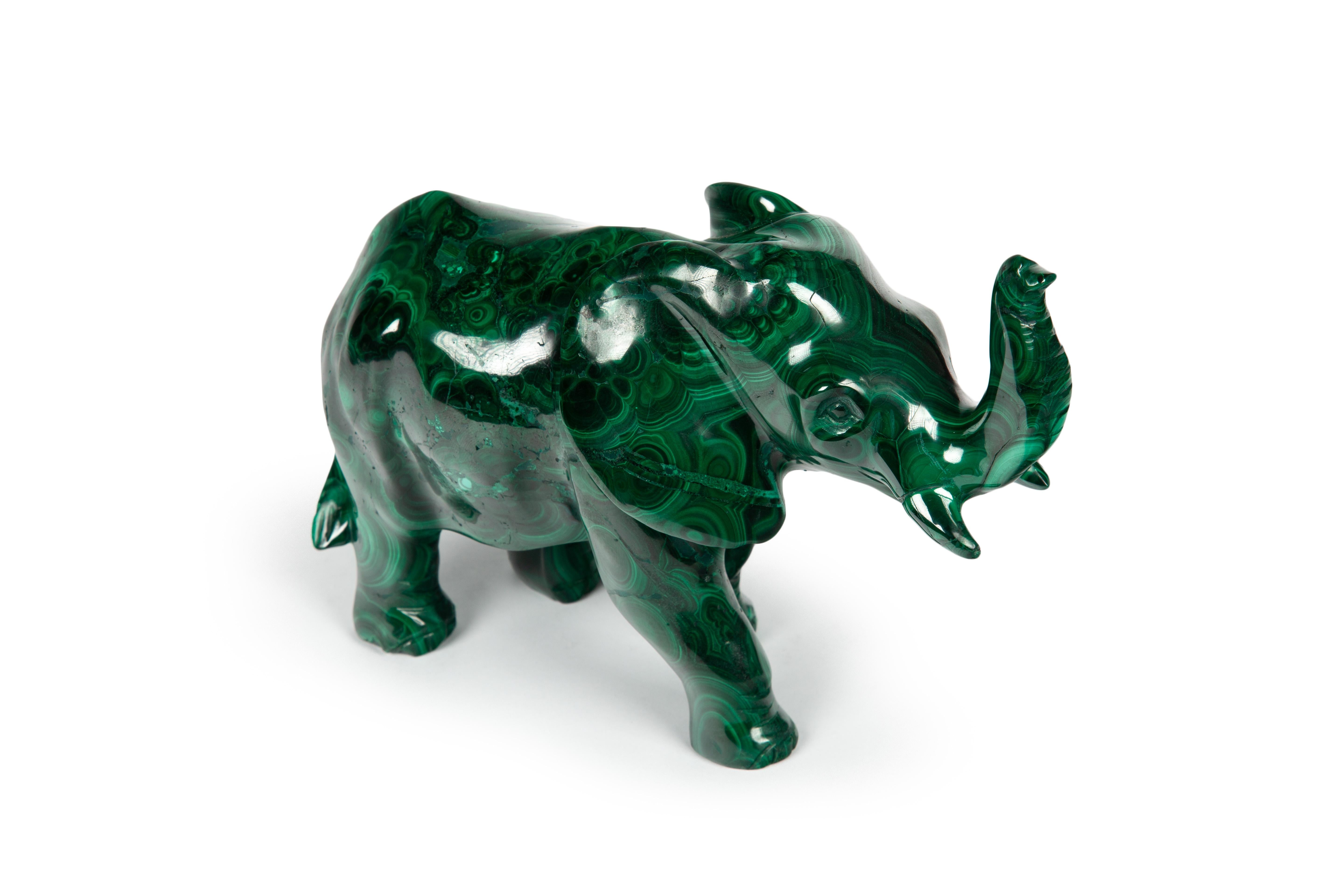 Carved Malachite Elephant:

This is a hand carved malachite animal that showcases the natural beauty and variety of this green mineral. Malachite is a copper carbonate hydroxide that forms in the earth's crust. It has been used for centuries as a