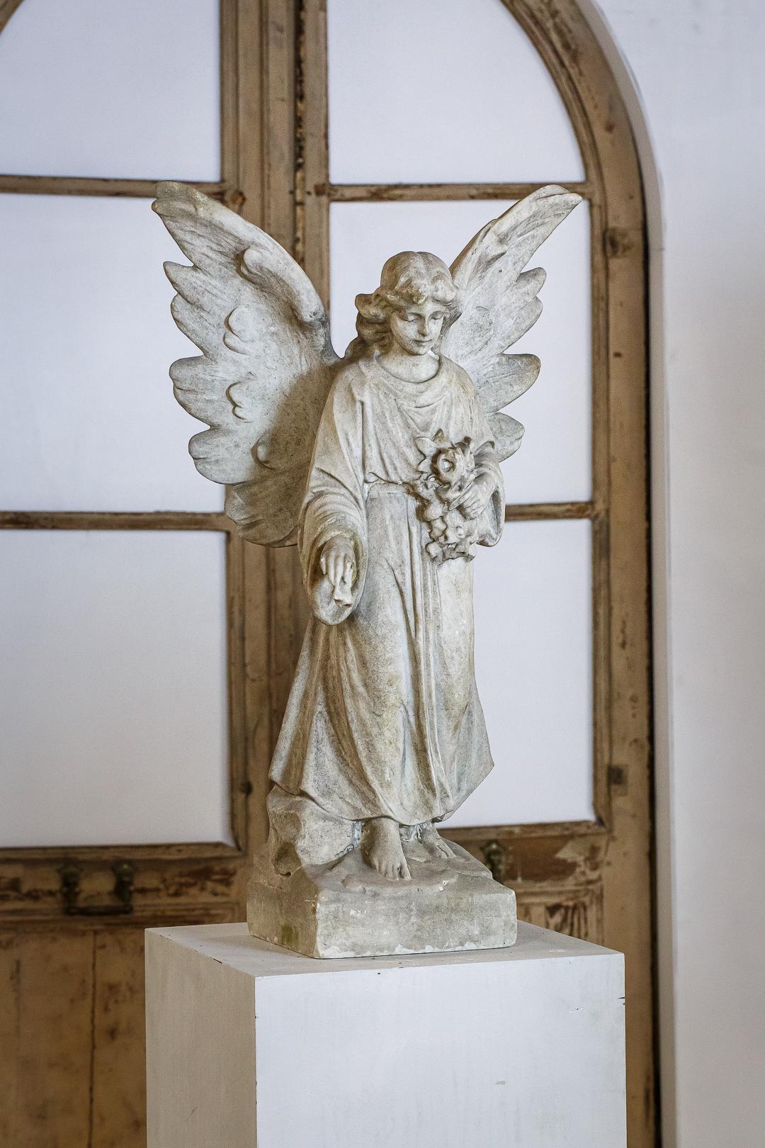 Extraordinary carved marble angel, with large outstretched wings as if about to take flight. Nice patination.