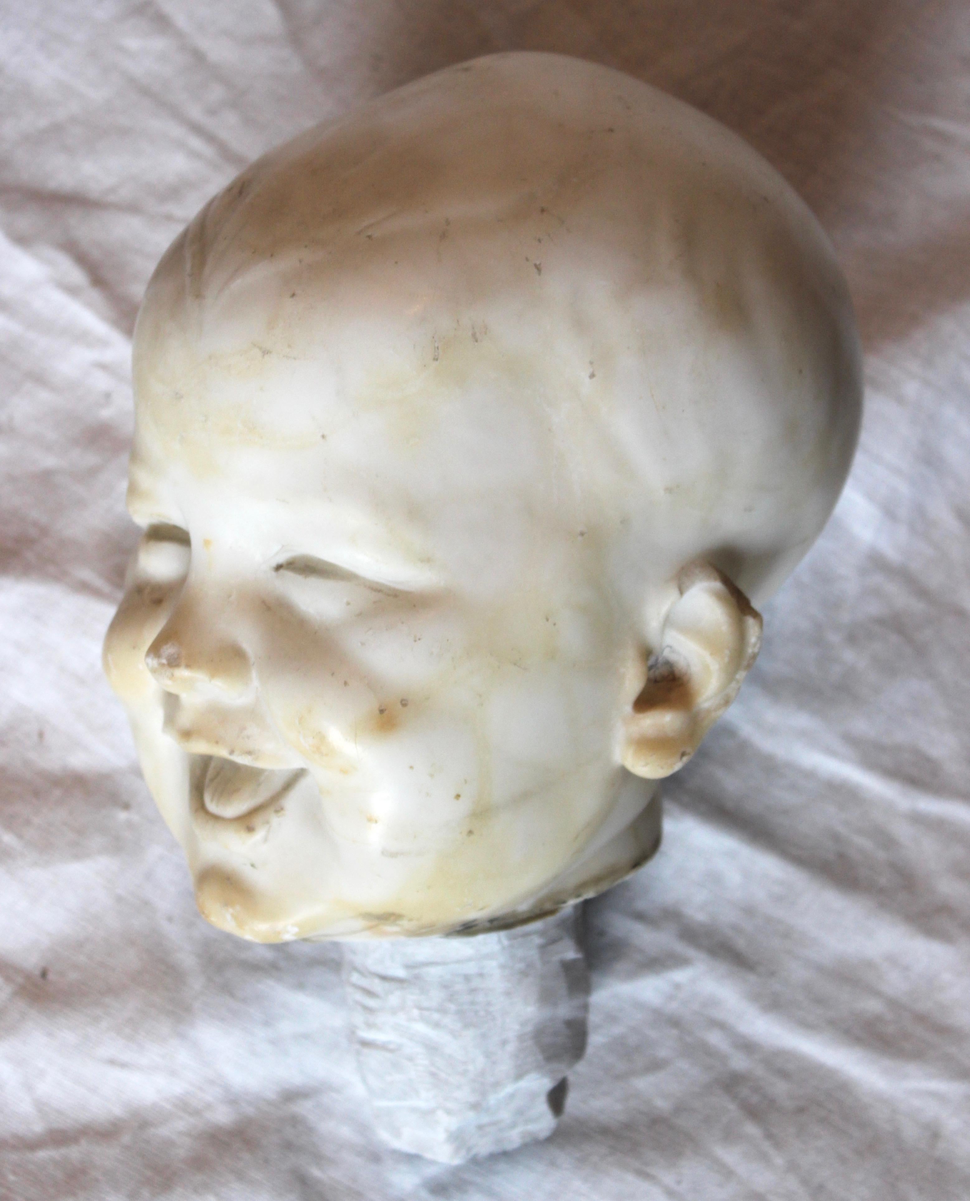 Carved Marble Infant's Head Sculpture Mounted on Metal Base In Good Condition In East Hampton, NY