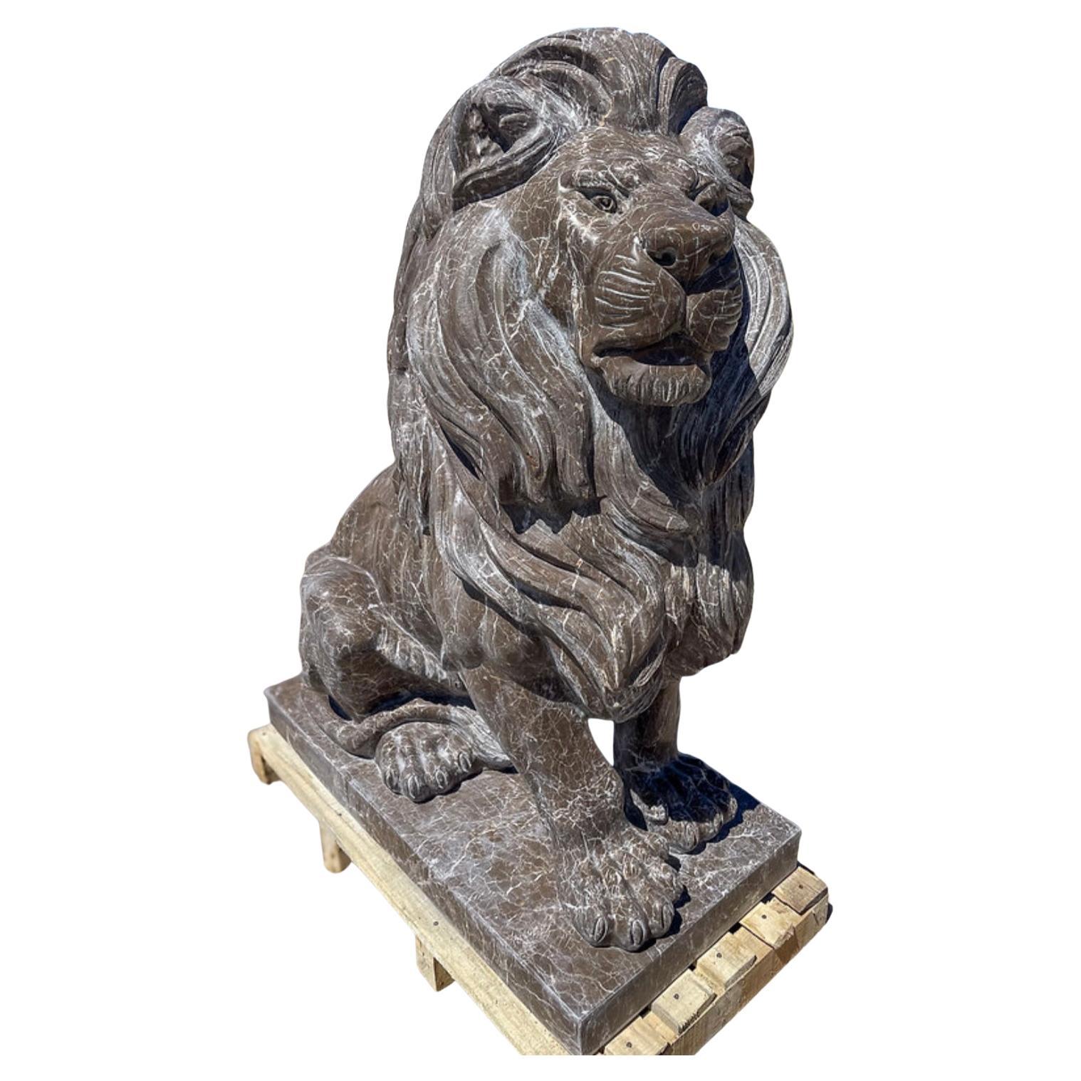 The Carved Marble Seated Estate Lions (21st Century) are majestic sculptures designed to bring an air of grandeur and protection to any estate or garden. Handcrafted from high-quality marble, each lion is meticulously carved with lifelike details,