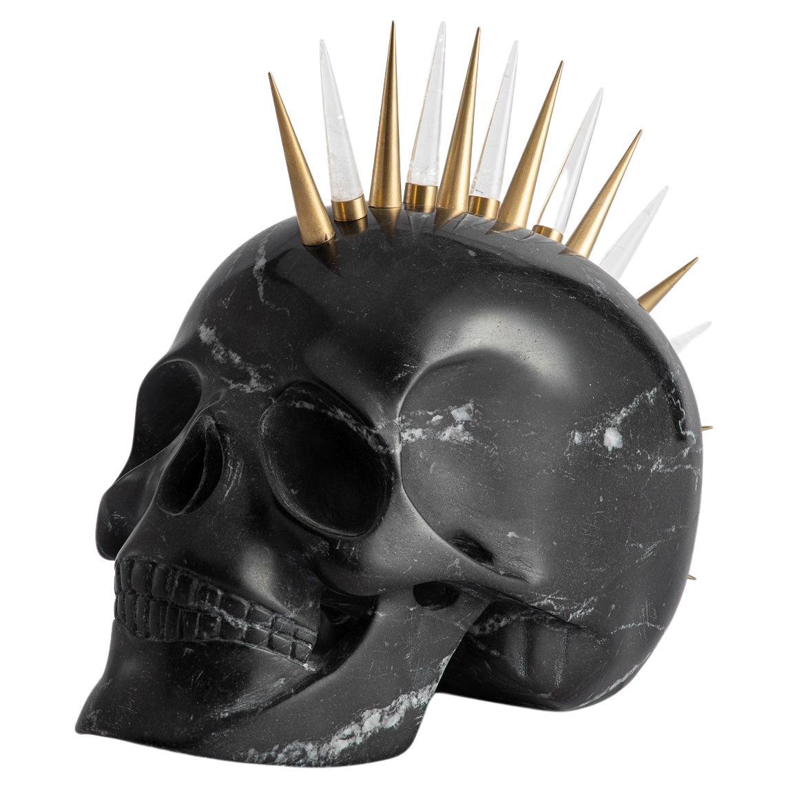 Engage your senses with this remarkable, carved Nero Marquina marble skull, a provocative work of art that revels in its audacious form. More than an artifact of the macabre, it is a stirring exploration of contrasting aesthetics and materials that