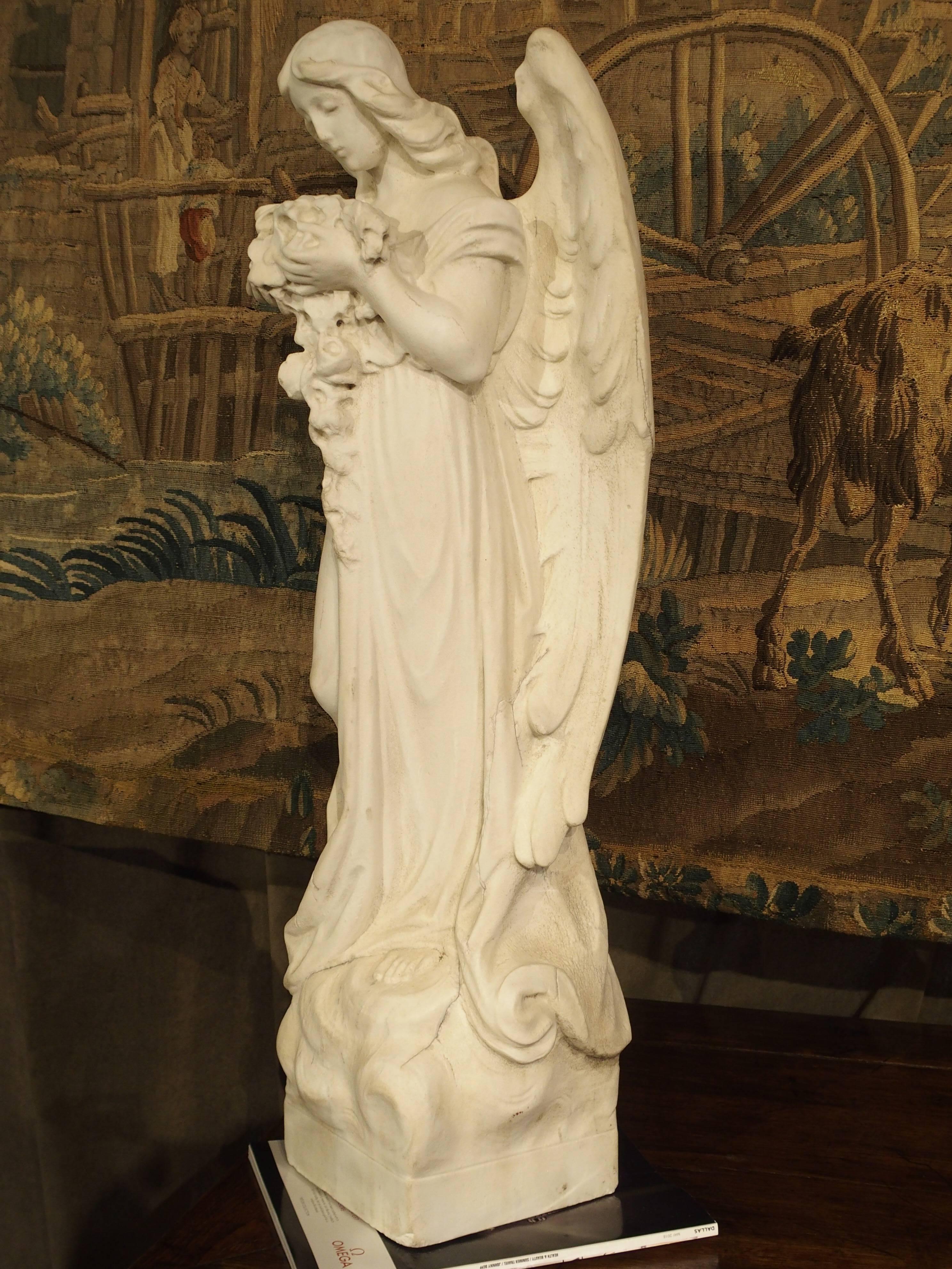 Carved Marble Statue of an Angel Holding a Bouquet 5
